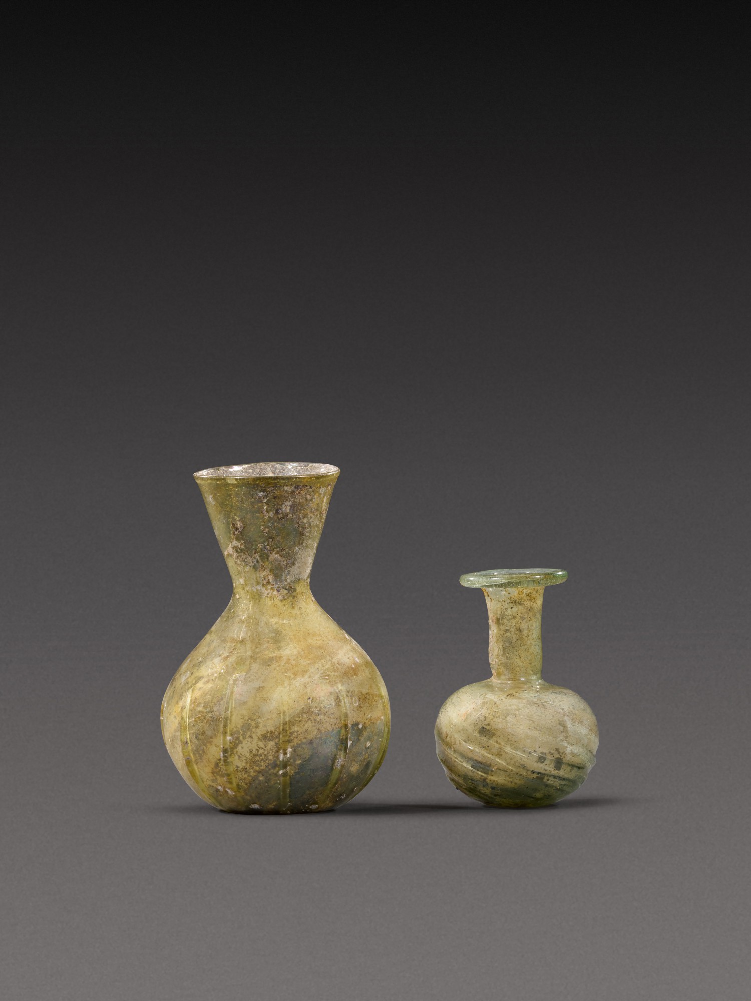 Two Roman Pale Green Glass Flasks