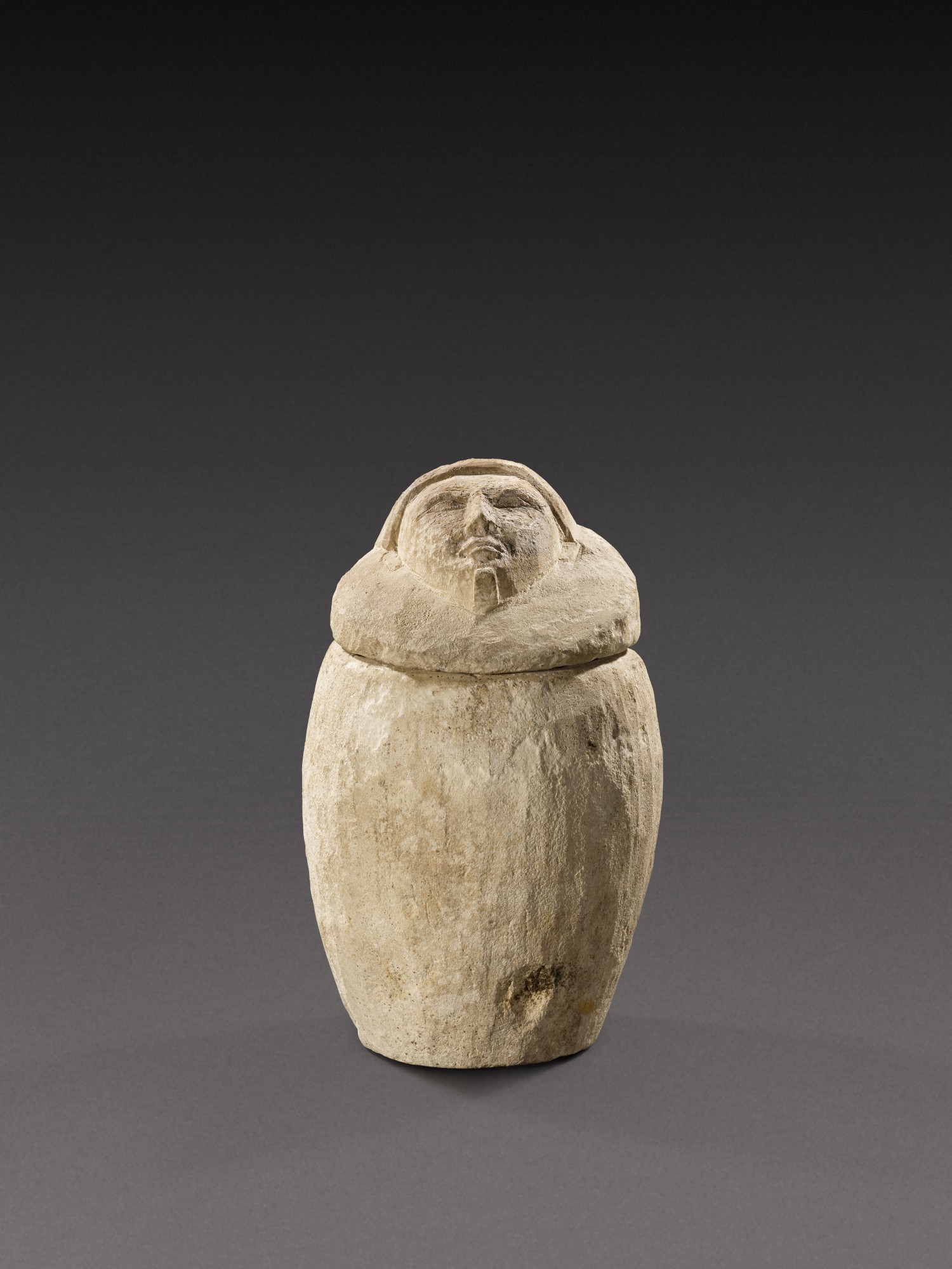 An Egyptian Limestone Canopic Jar
