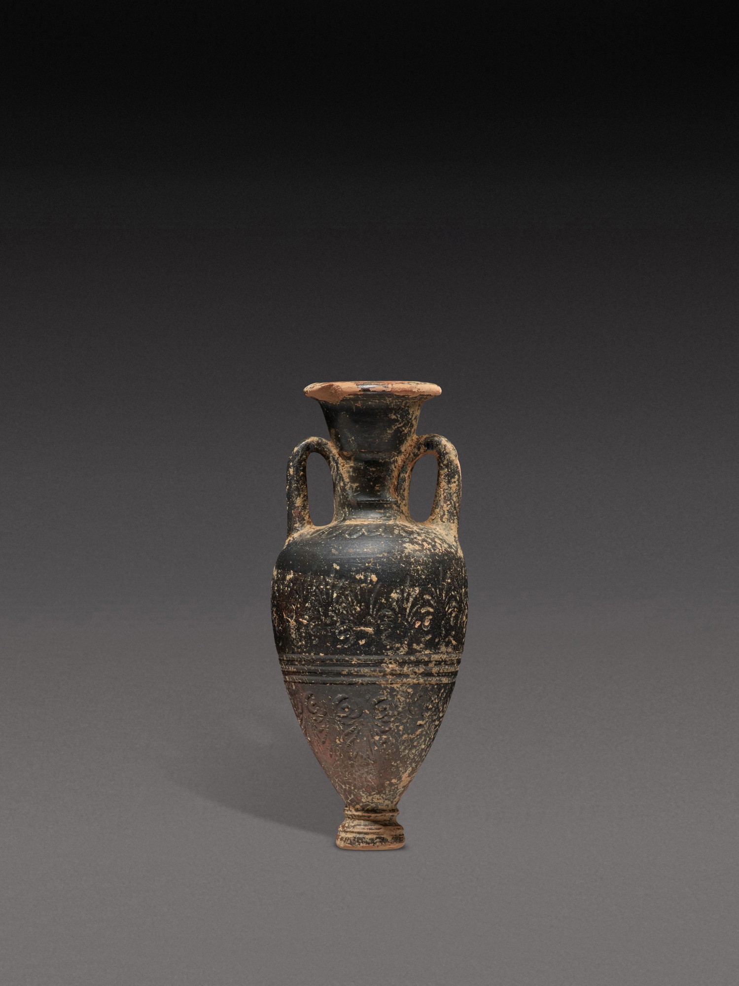 An Attic Black-glazed Pointed Amphoriskos