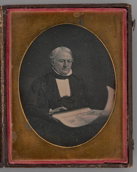 Untitled (Portrait of a Seated Man Holding a Map)