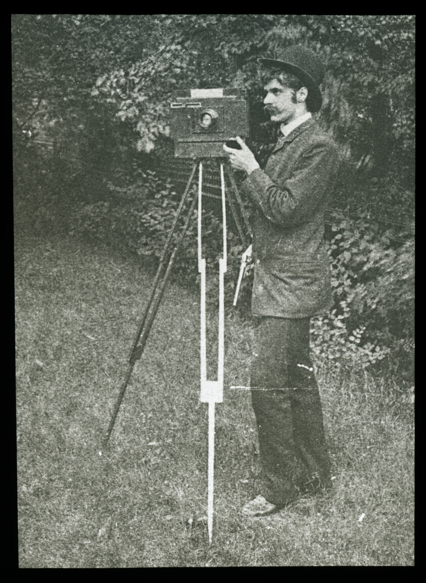 Alfred Stieglitz — Self-Portrait with camera, tripod and pistol