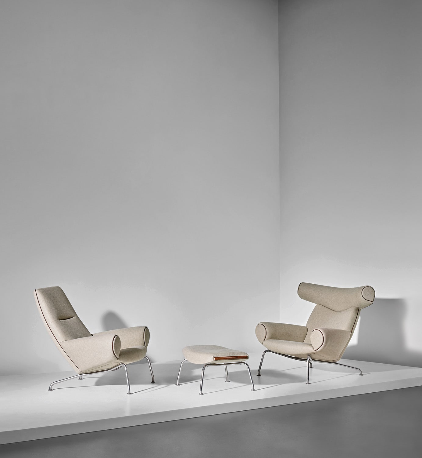 Two early 'Ox' lounge armchairs, model nos. AP-46 and AP-47, and ottoman, model no. AP-49