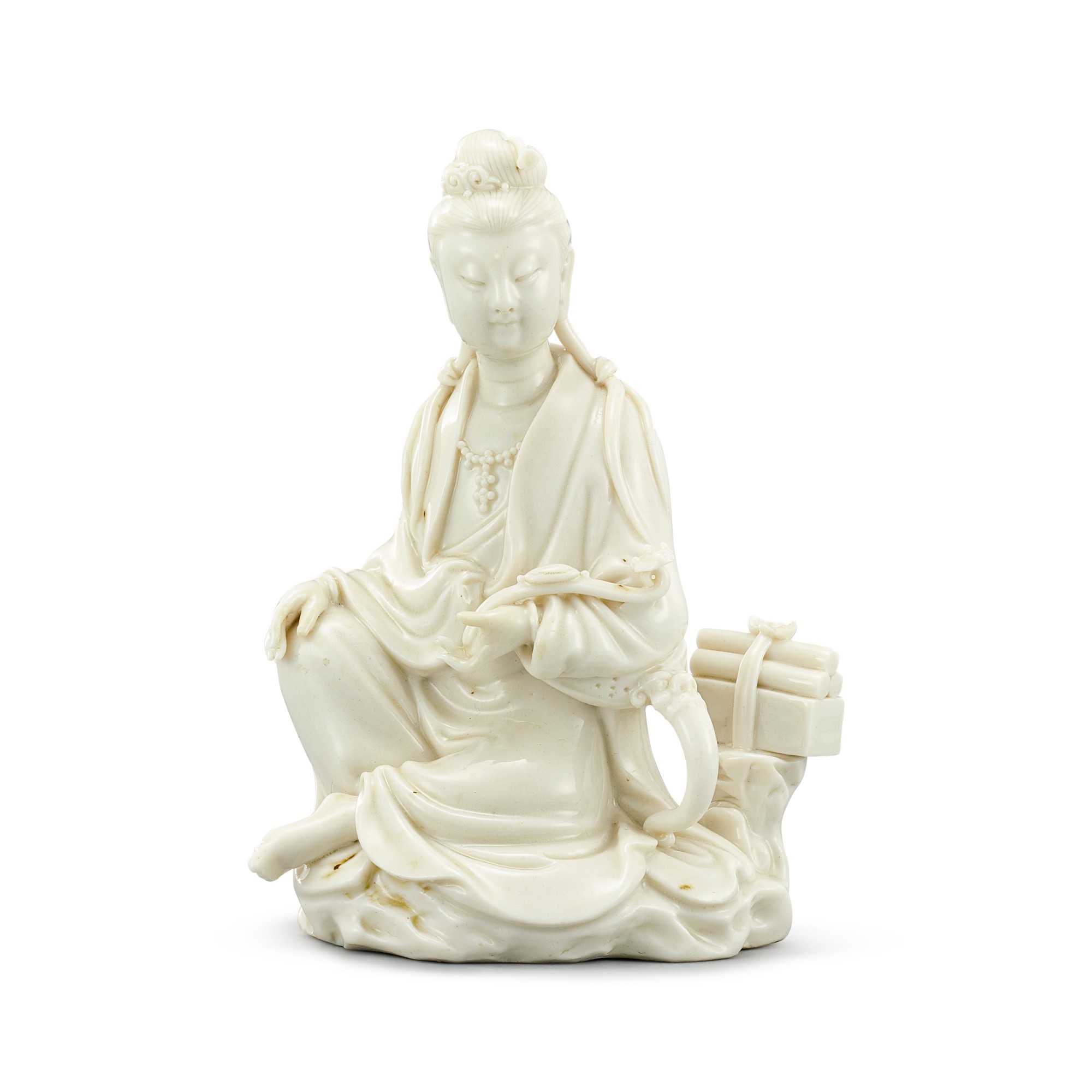 A Dehua figure of Guanyin — 清十八至十九世紀初 德化白瓷觀音坐像 《何朝宗》仿款