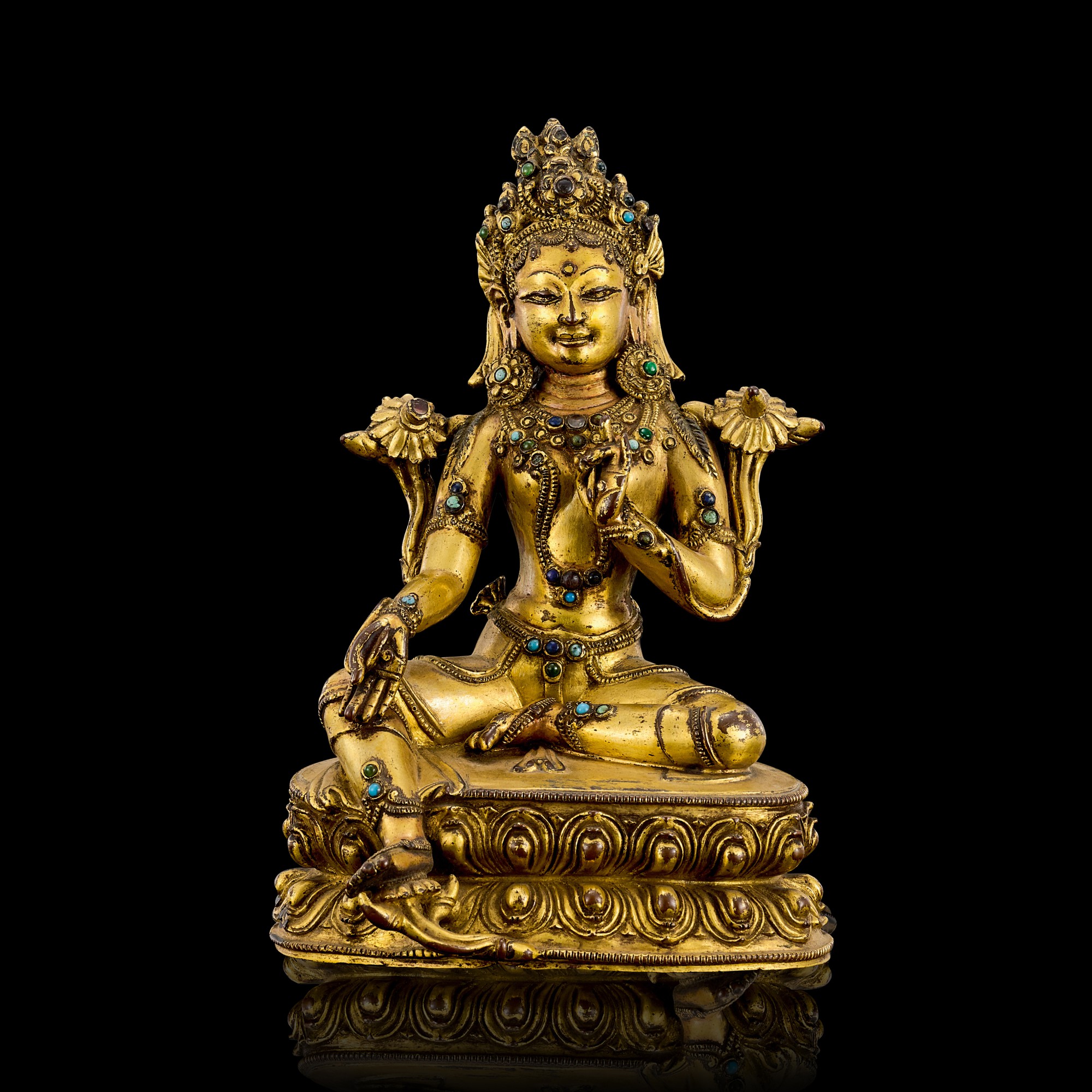A gilt copper alloy figure of Green Tara — 十四至十五世紀 西藏鎏金銅綠度母坐像