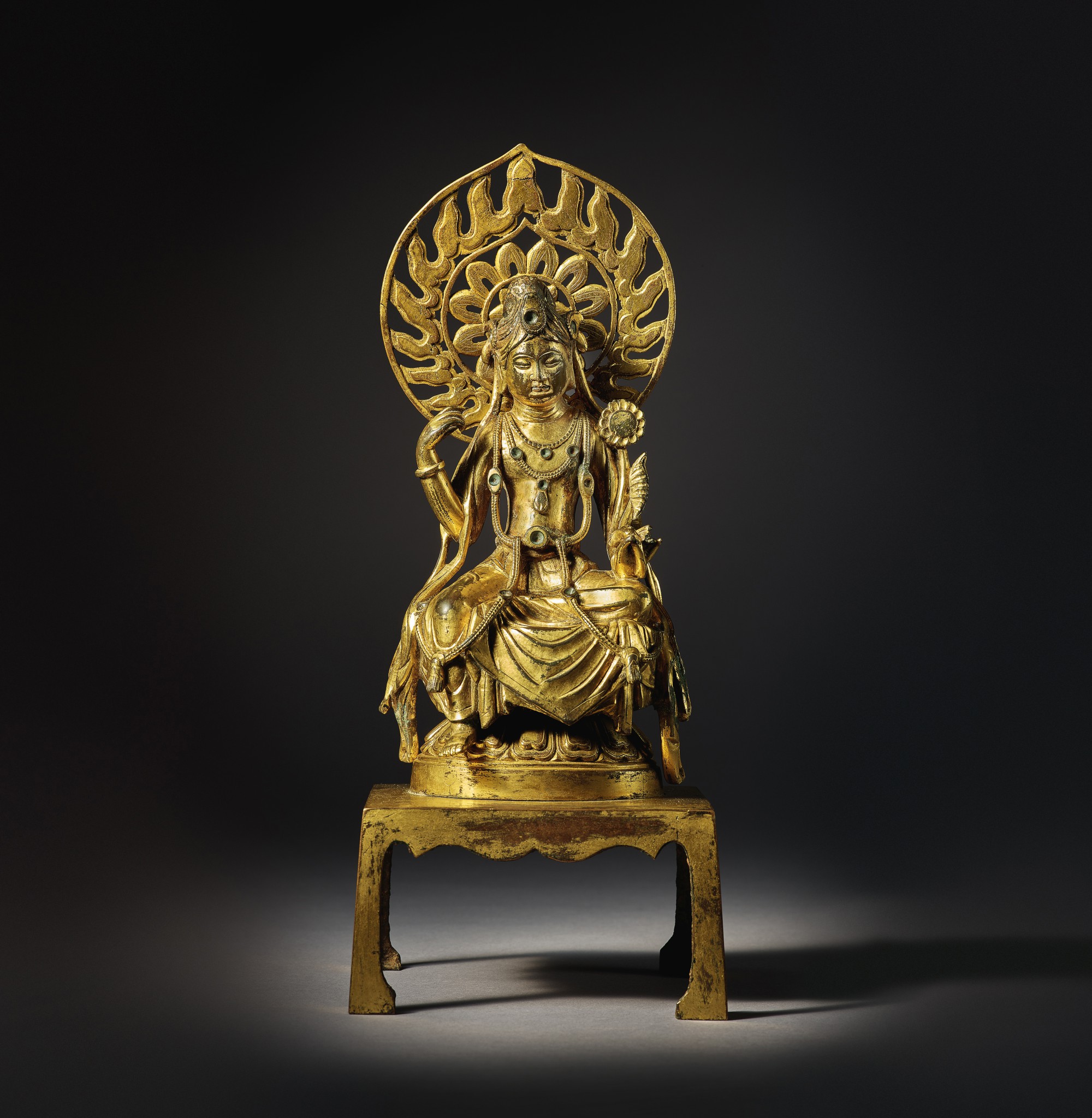 A magnificent and extremely rare gilt-bronze figure of Padmapani — 唐 鎏金銅蓮華手觀音坐像