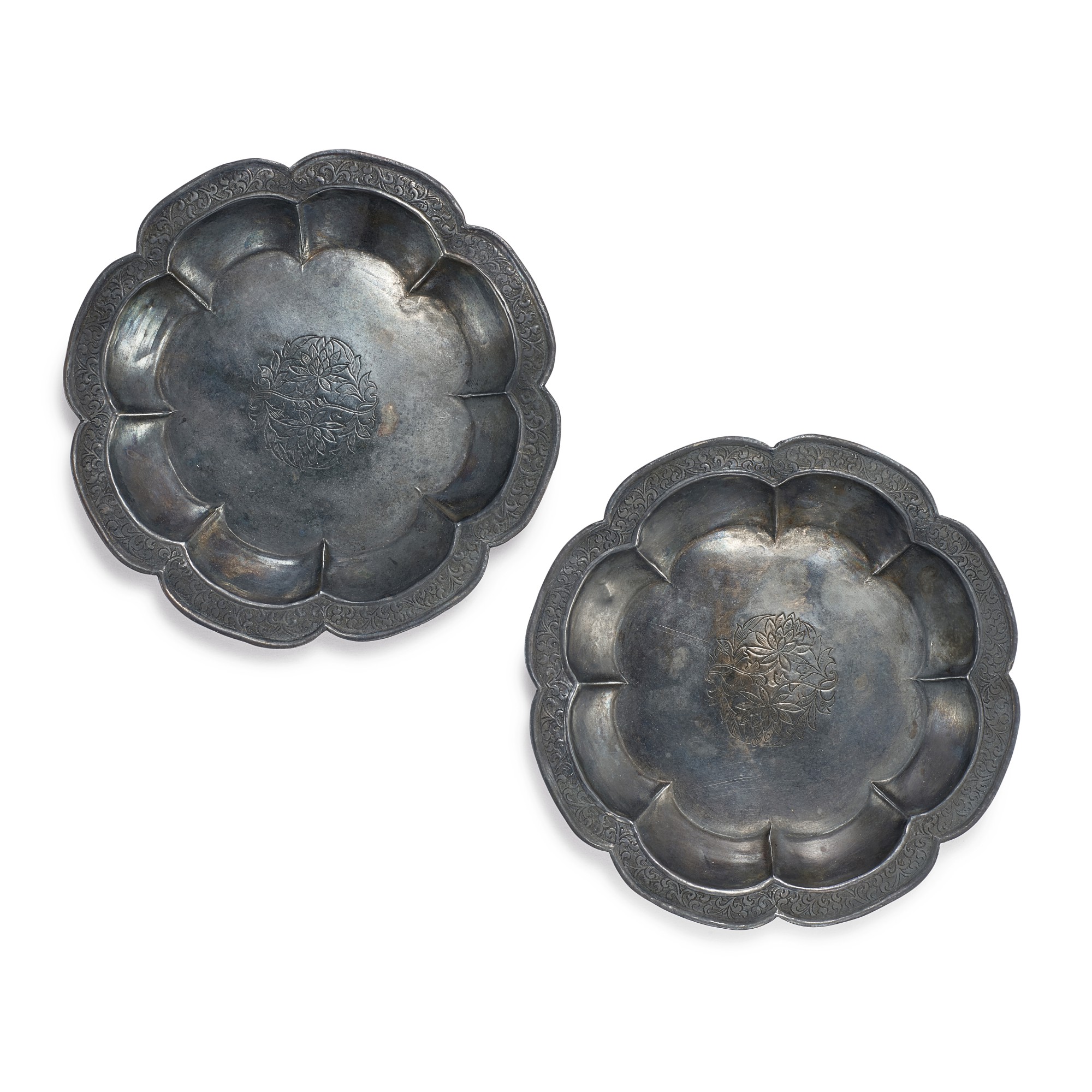 A pair of silver 'lotus' lobed dishes, — A pair of silver 'lotus' lobed dishes, Song dynasty 宋 銀鏨花折沿葵口盤一對