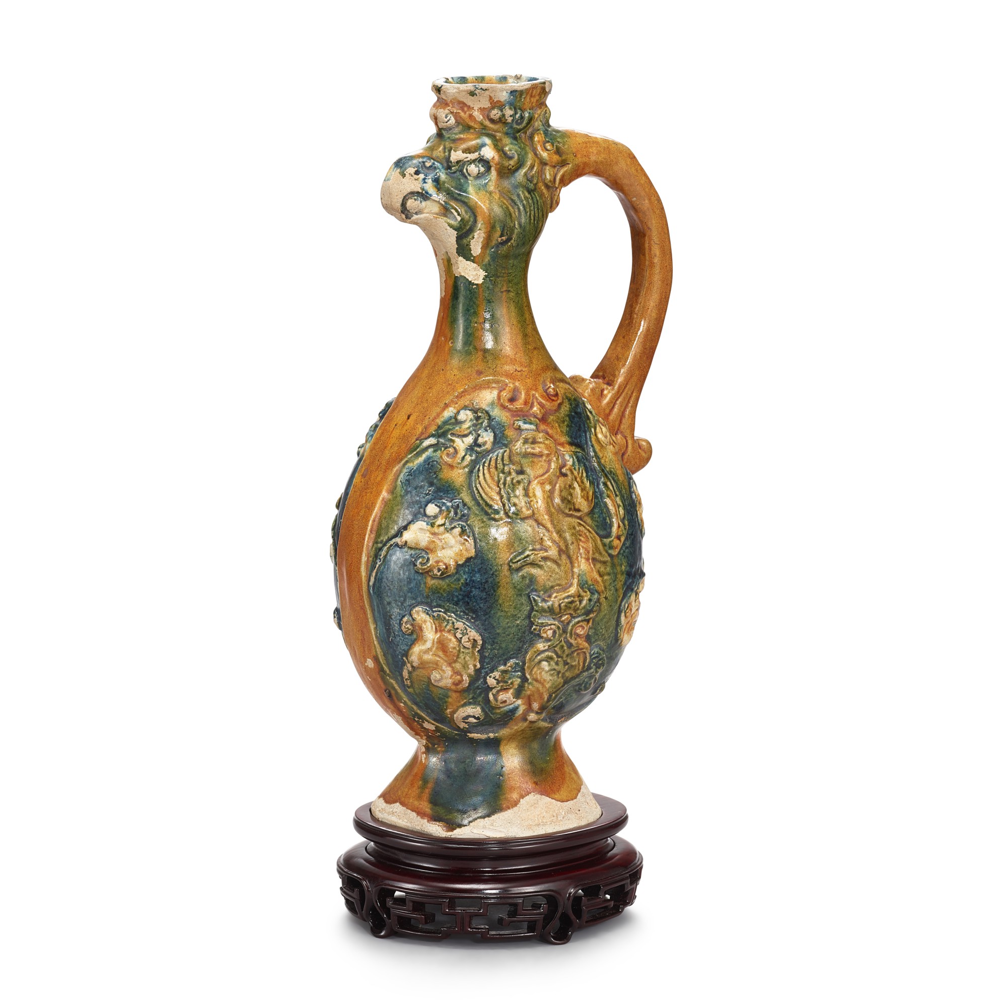 A sancai 'phoenix' ewer, — A sancai 'phoenix' ewer, Tang dynasty 唐 三彩鳳首執壺