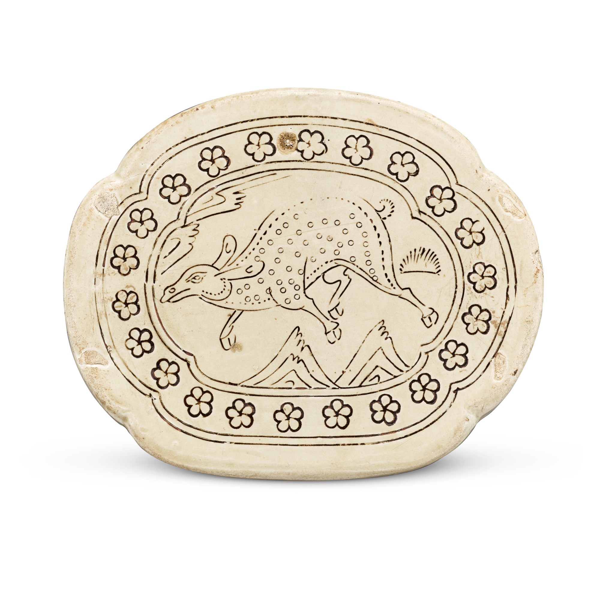 Unknown — A Dingyao carved 'deer' pillow, Northern Song dynasty 北宋 定窰白地黑彩劃鹿紋海棠形枕