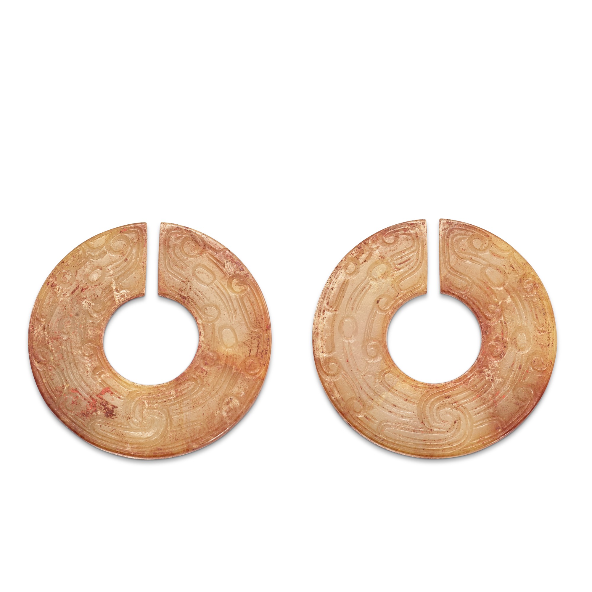 A pair of jade 'dragons' slit rings, — A pair of jade 'dragons' slit rings, Han dynasty 漢 龍紋玉玦一對