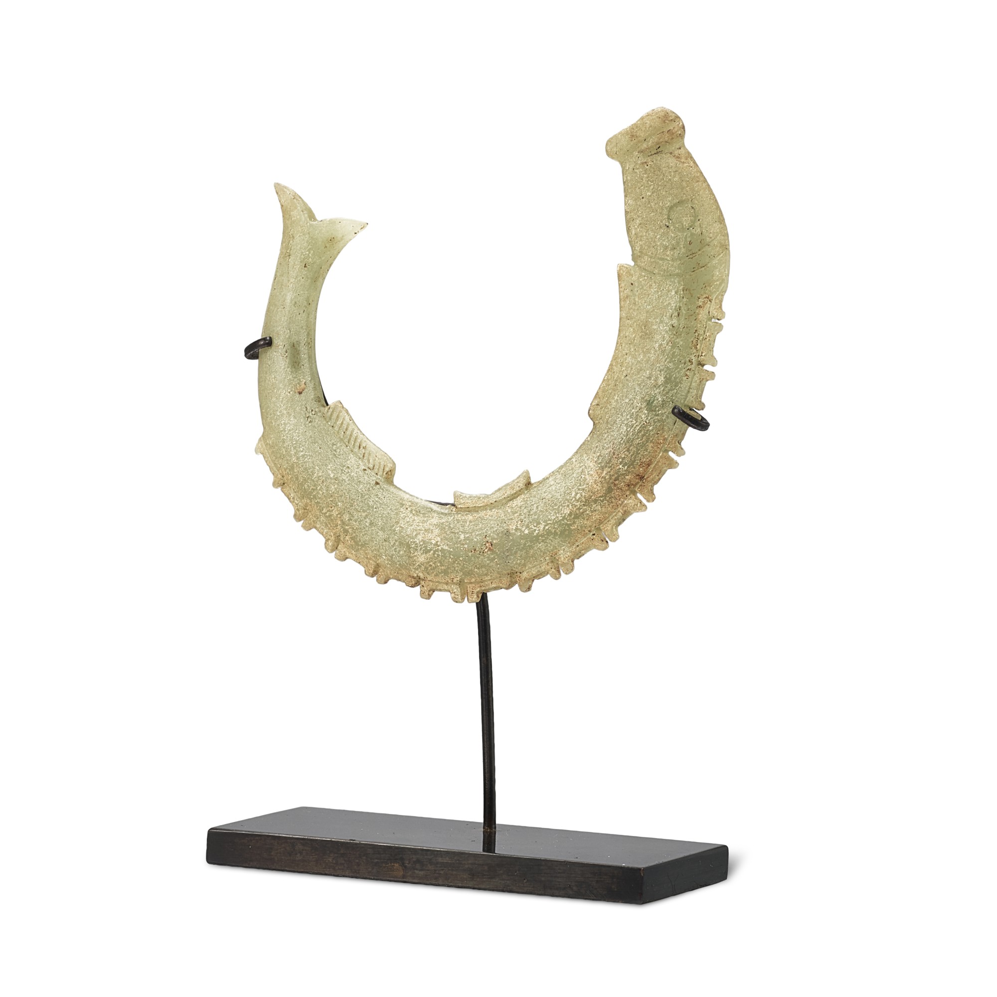 A celadon jade 'fish' pendant, — A celadon jade 'fish' pendant,  Shang dynasty - Warring States period or later  商至戰國或以後 青玉魚形珮