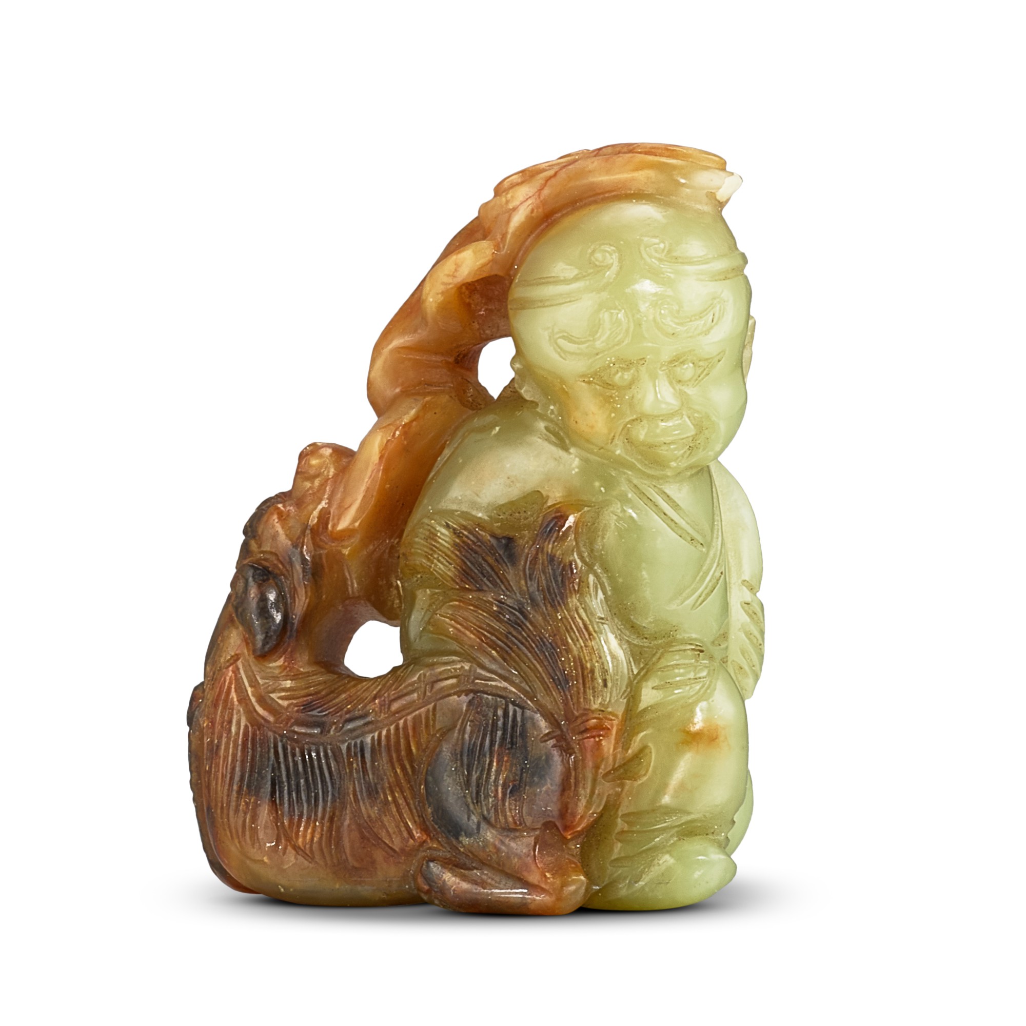 A yellow and russet jade 'foreigner and lion' group, — A yellow and russet jade 'foreigner and lion' group, Ming - Qing dynasty 明至清 黃玉胡人戲獅