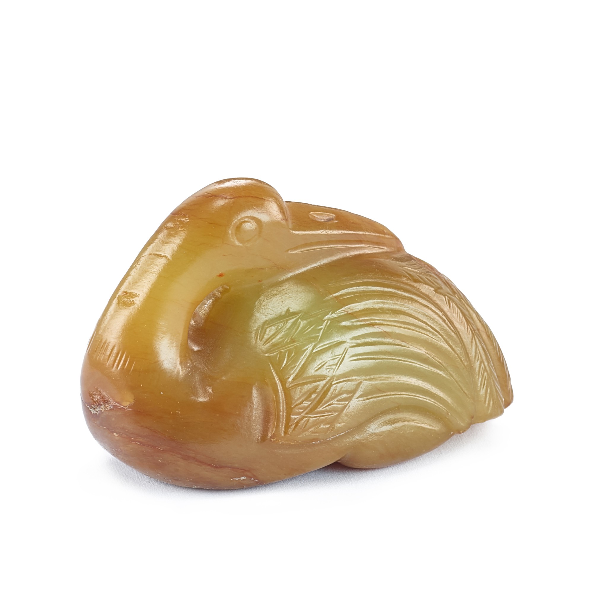A yellow and russet jade figure of a crane, — A yellow and russet jade figure of a crane, 17th century 十七世紀 黃玉壽鶴