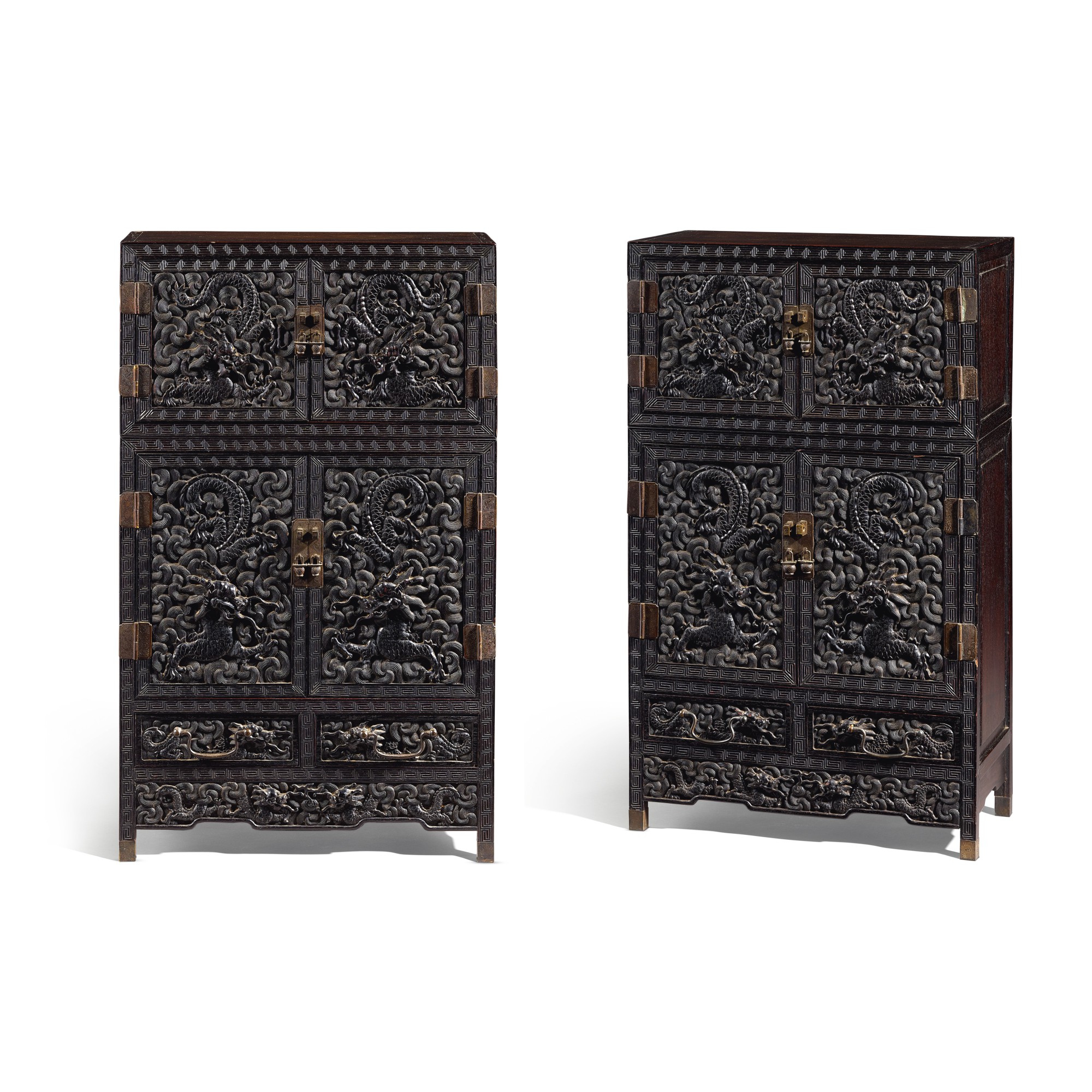 Unknown (Historical) — A pair of carved zitan 'dragon' cabinets, Kanggui 紫檀雕雲龍紋炕櫃一對