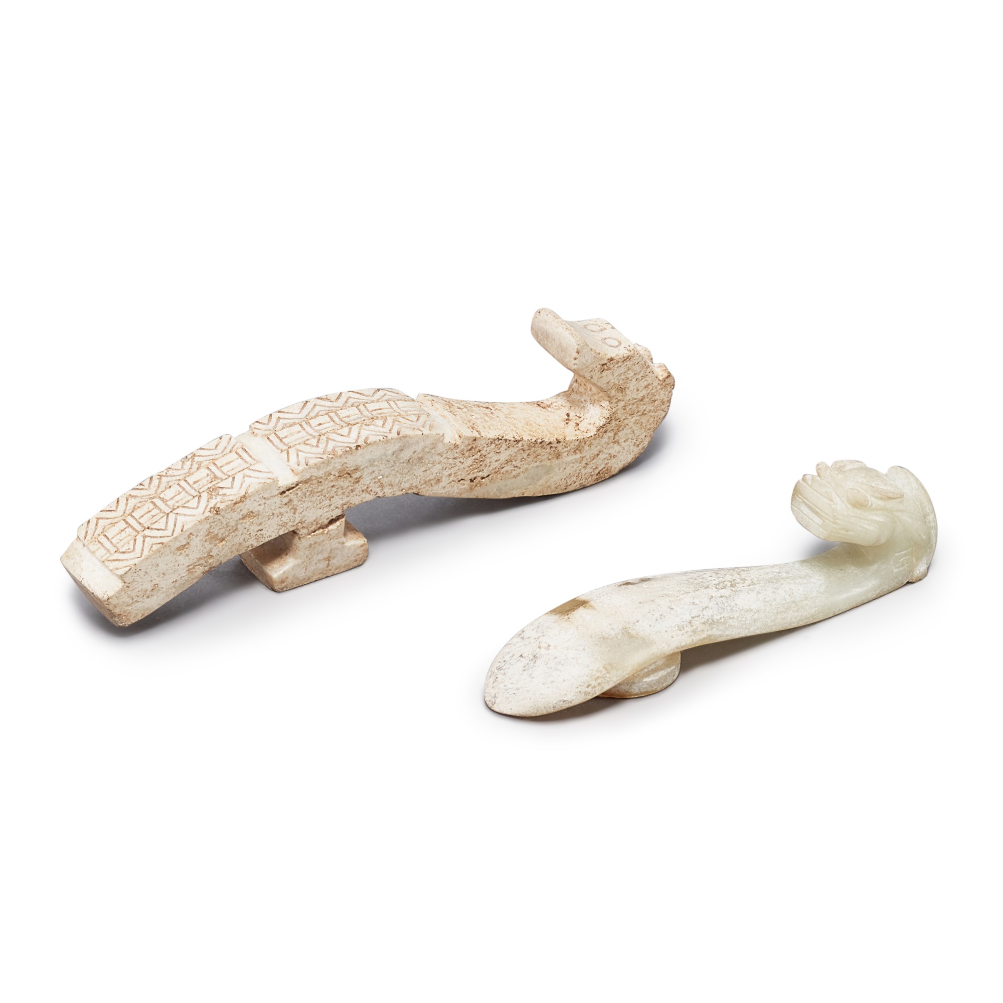 Two calcified jade 'dragon' belt hooks,