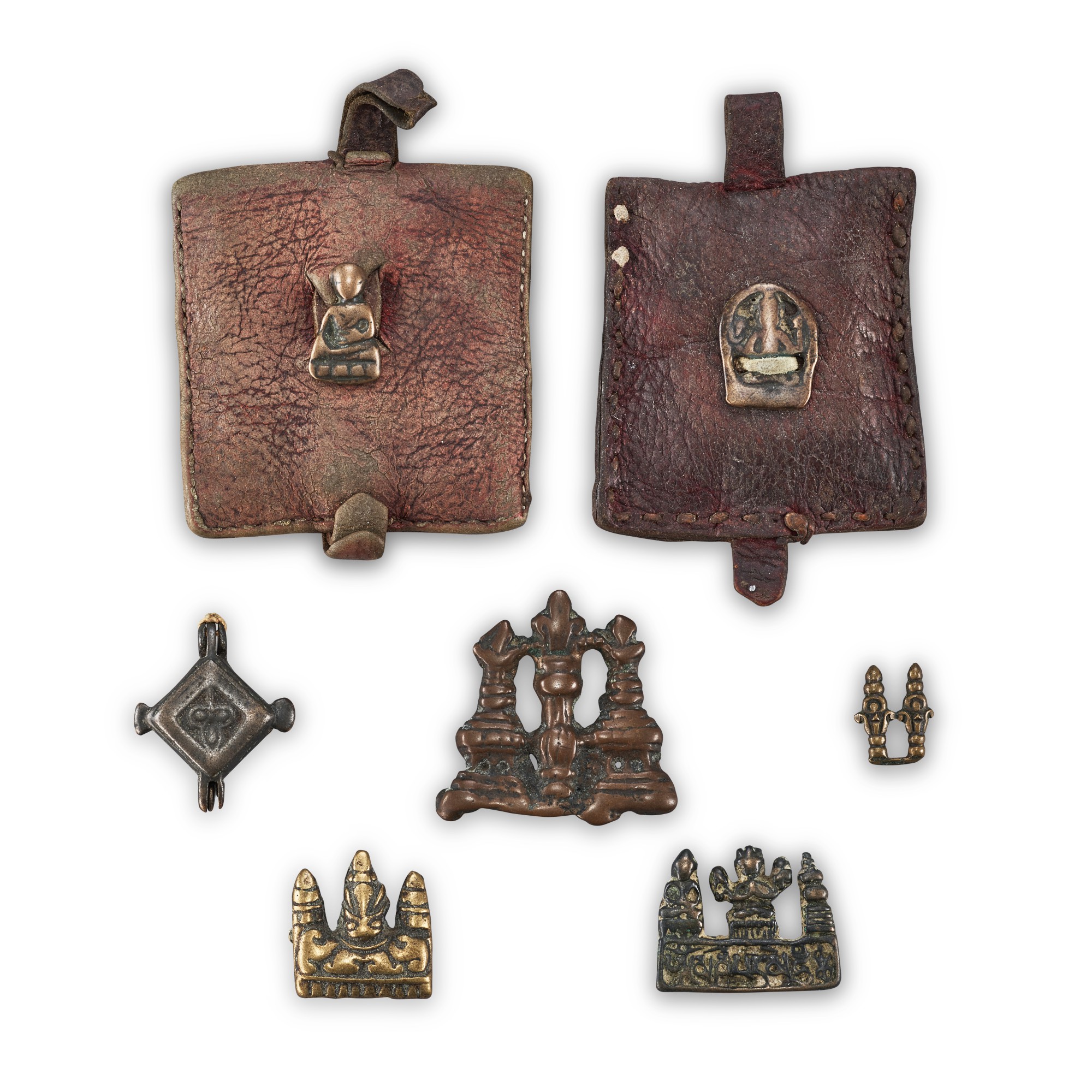 A group of copper-alloy 'stupa' thogchags, Gau box and leather pouches, — A group of copper-alloy 'stupa' thogchags, Gau box and leather pouches, Tibet, 12th - 15th century 十二至十五世紀 西藏 各式舍利塔天鐵、嘎鳥及皮包一組七件