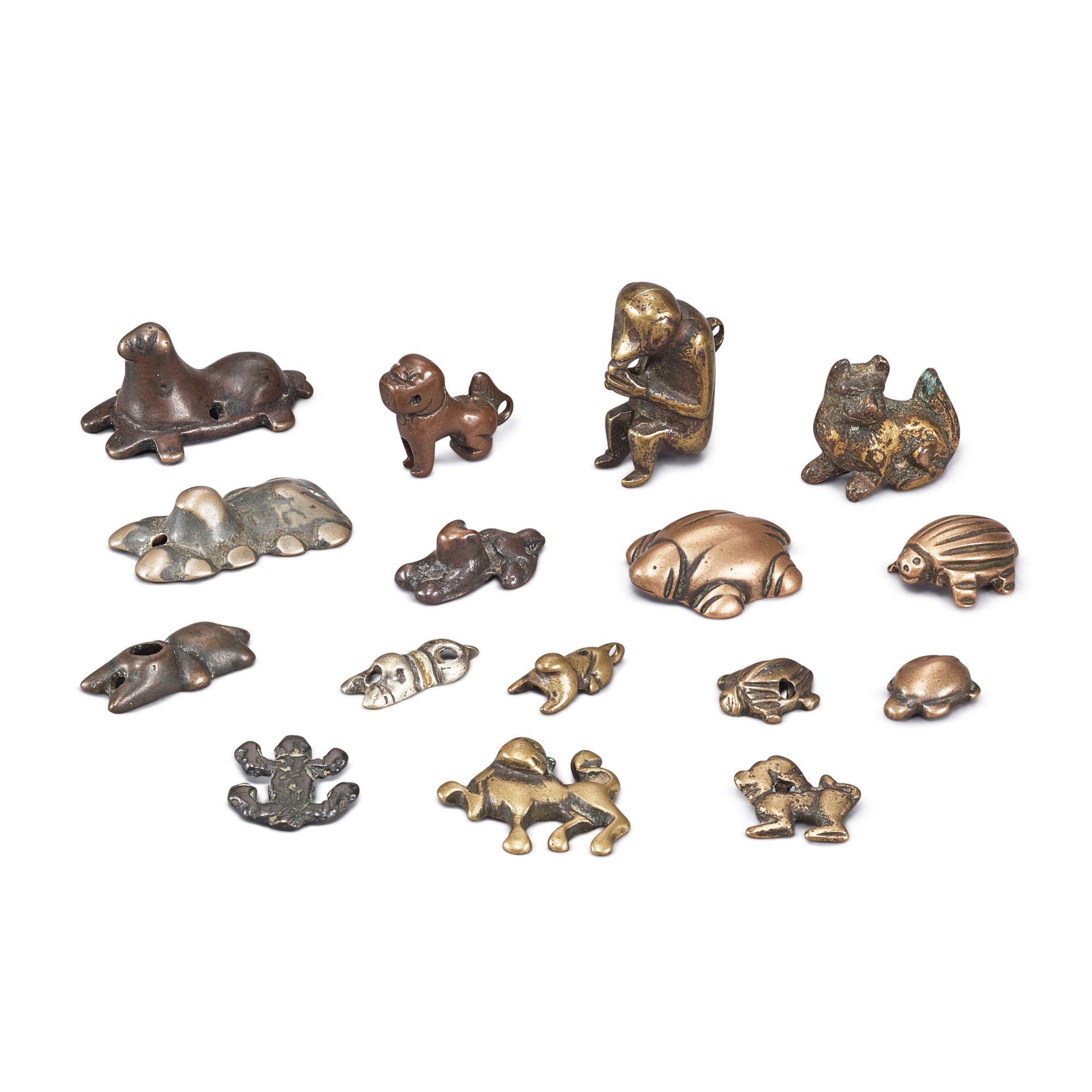 A group of 16 copper-alloy 'animal' thogchags, — A group of 16 copper-alloy 'animal' thogchags, Tibet, 6th - 15th century 六至十五世紀 西藏 各式獮猴、臥獅、瑞龜紋天鐵一組十六件
