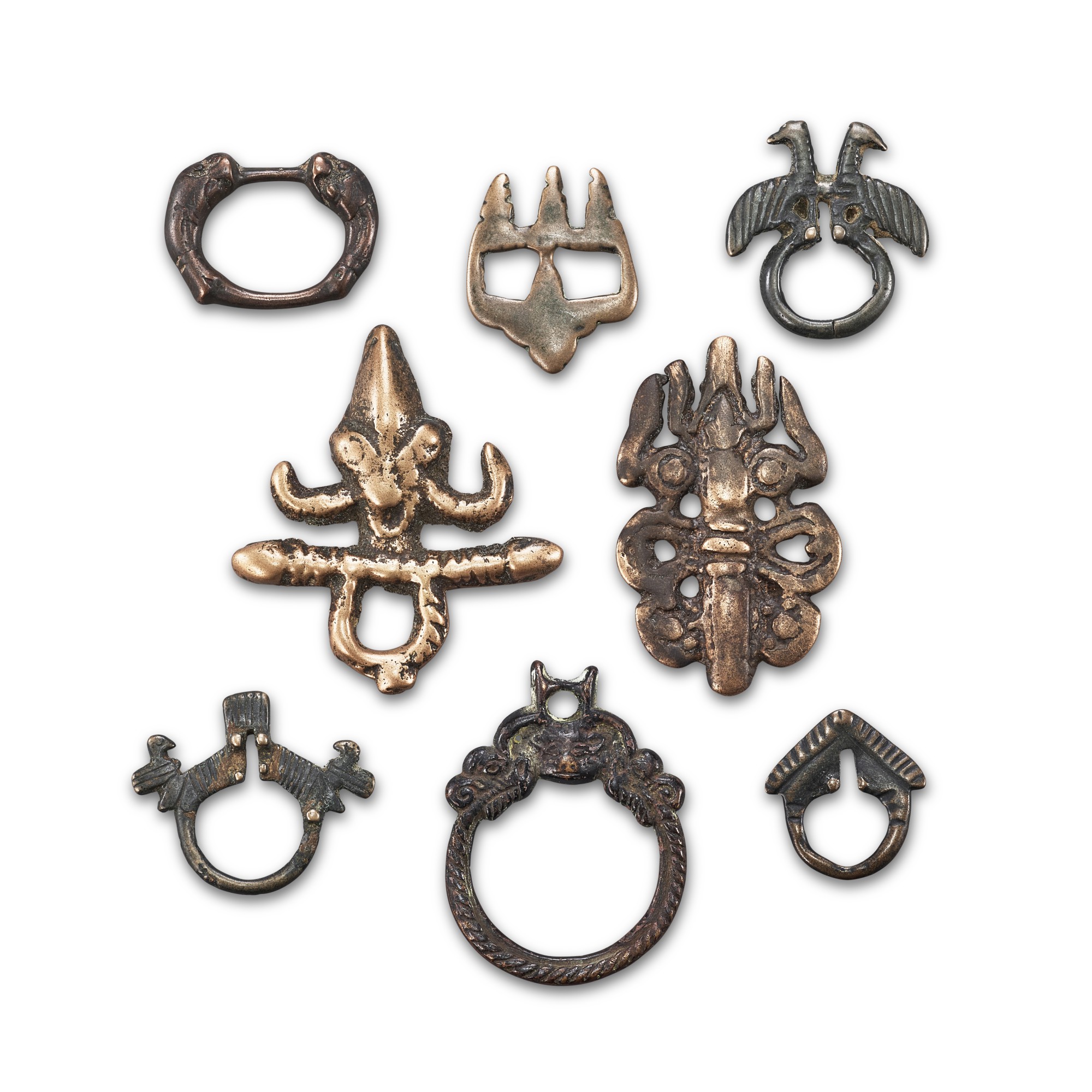 A group of 8 copper-alloy thogchags, — A group of 8 copper-alloy thogchags, Tibet, 12th - 15th century 十二至十五世紀 西藏 各式鳥獸紋及如意珠紋天鐵一組八件
