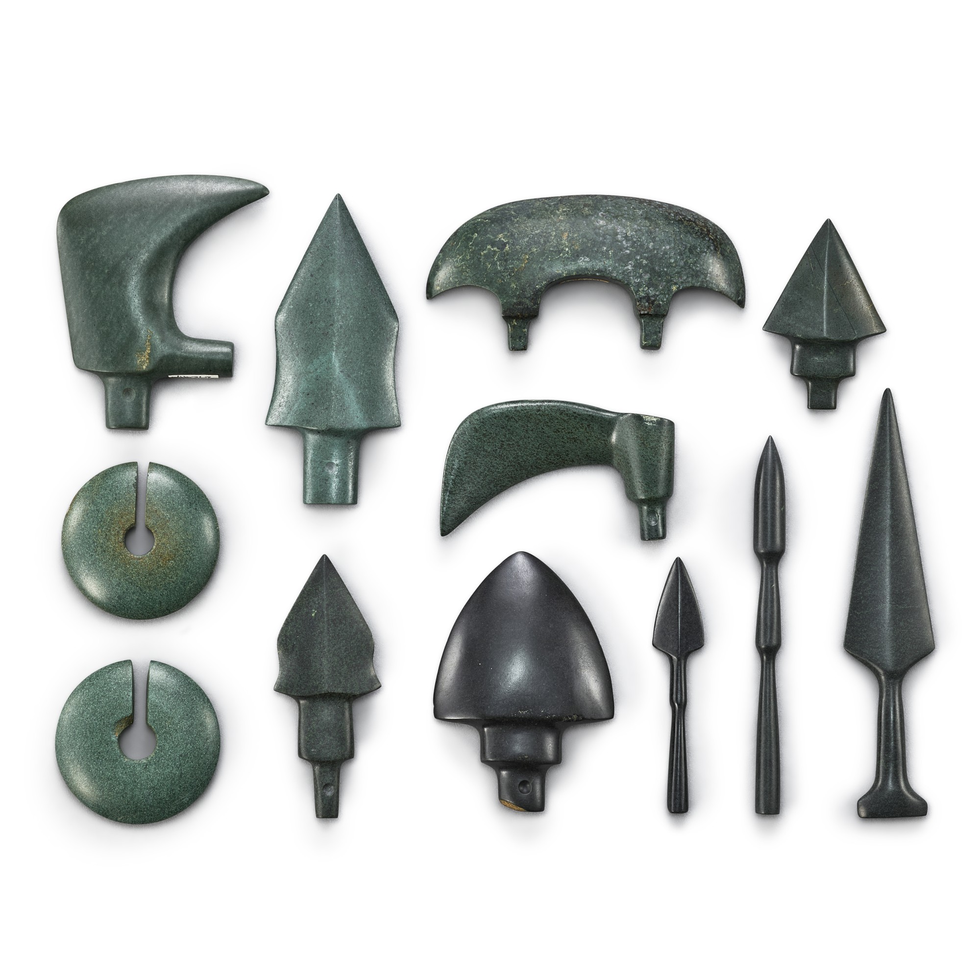 A group of 12 hardstone weapons and slit rings, — A group of 12 hardstone weapons and slit rings, Vietnam, Gò Mun culture, circa 8th century BCE 約公元前八世紀 安南椚丘文化 各式石鏃及玦一組十二件