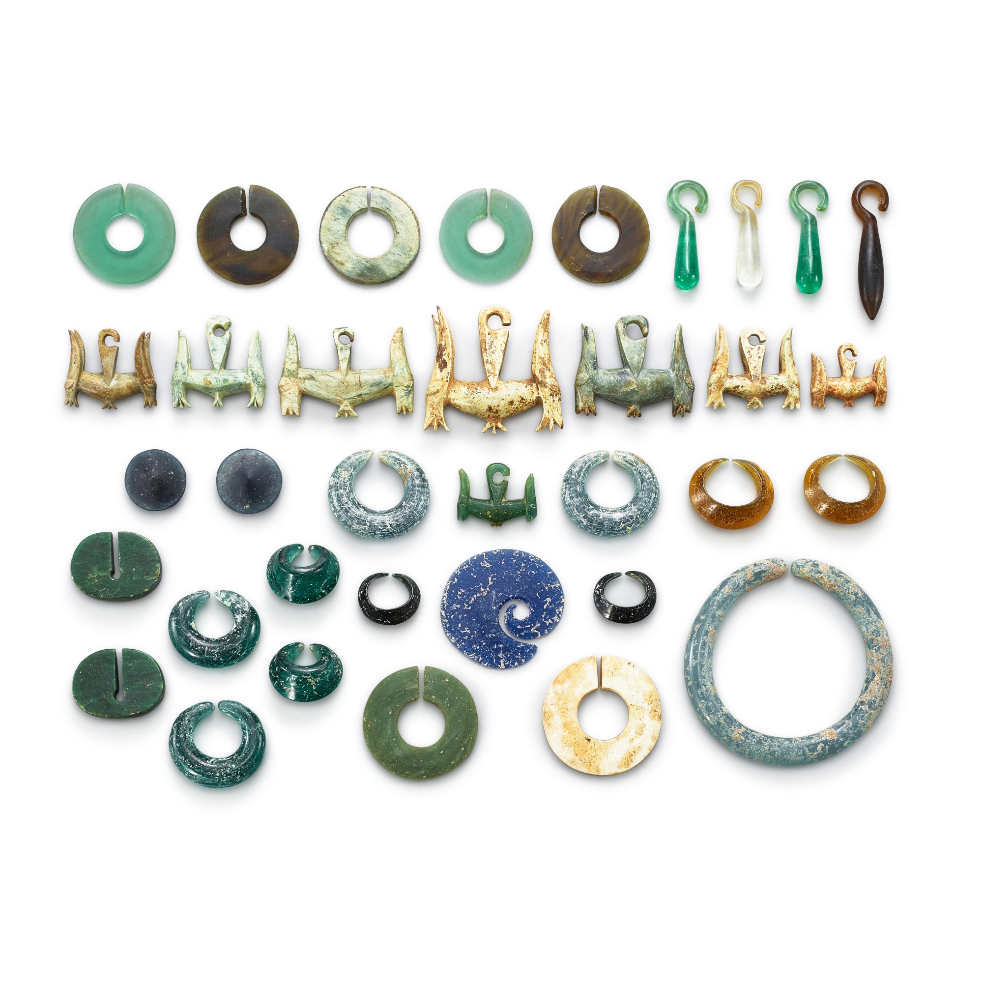 Vietnam, circa 3rd century — A collection of 35 jewellery pieces, Vietnam, circa 3rd century 約三世紀 安南 各式玻璃及玉石珮飾一組三十五件