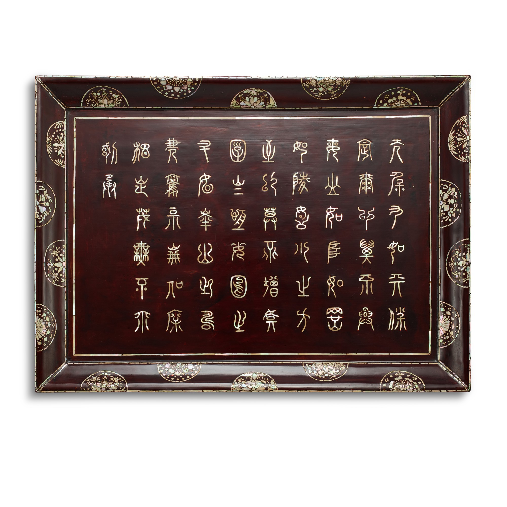 A mother-of-pearl-inlaid lacquer 'longevity' tray, — A mother-of-pearl-inlaid lacquer 'longevity' tray, 17th century 十七世紀 黑漆嵌螺鈿天保九如長方盤