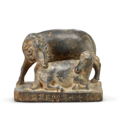 An inscribed stone 'ram' group,