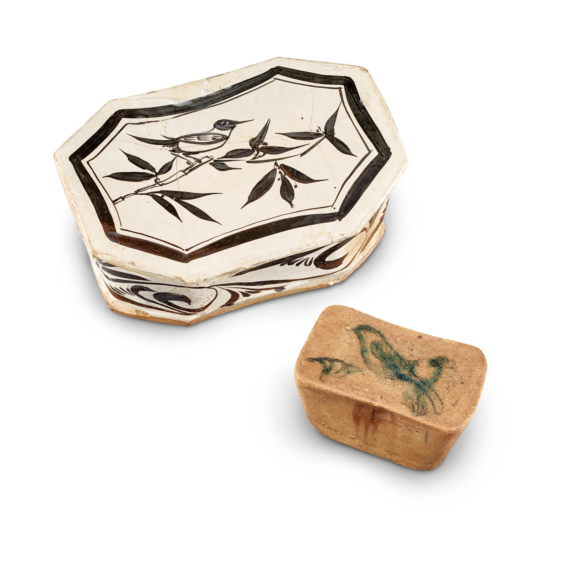Unknown — A Cizhou painted 'magpie' pillow, Jin dynasty, and a Changsha painted 'bird' pillow, Tang dynasty 金 磁州窰白地黑花喜鵲紋八方枕 及 唐 長沙窰黃釉綠彩花鳥紋長方枕