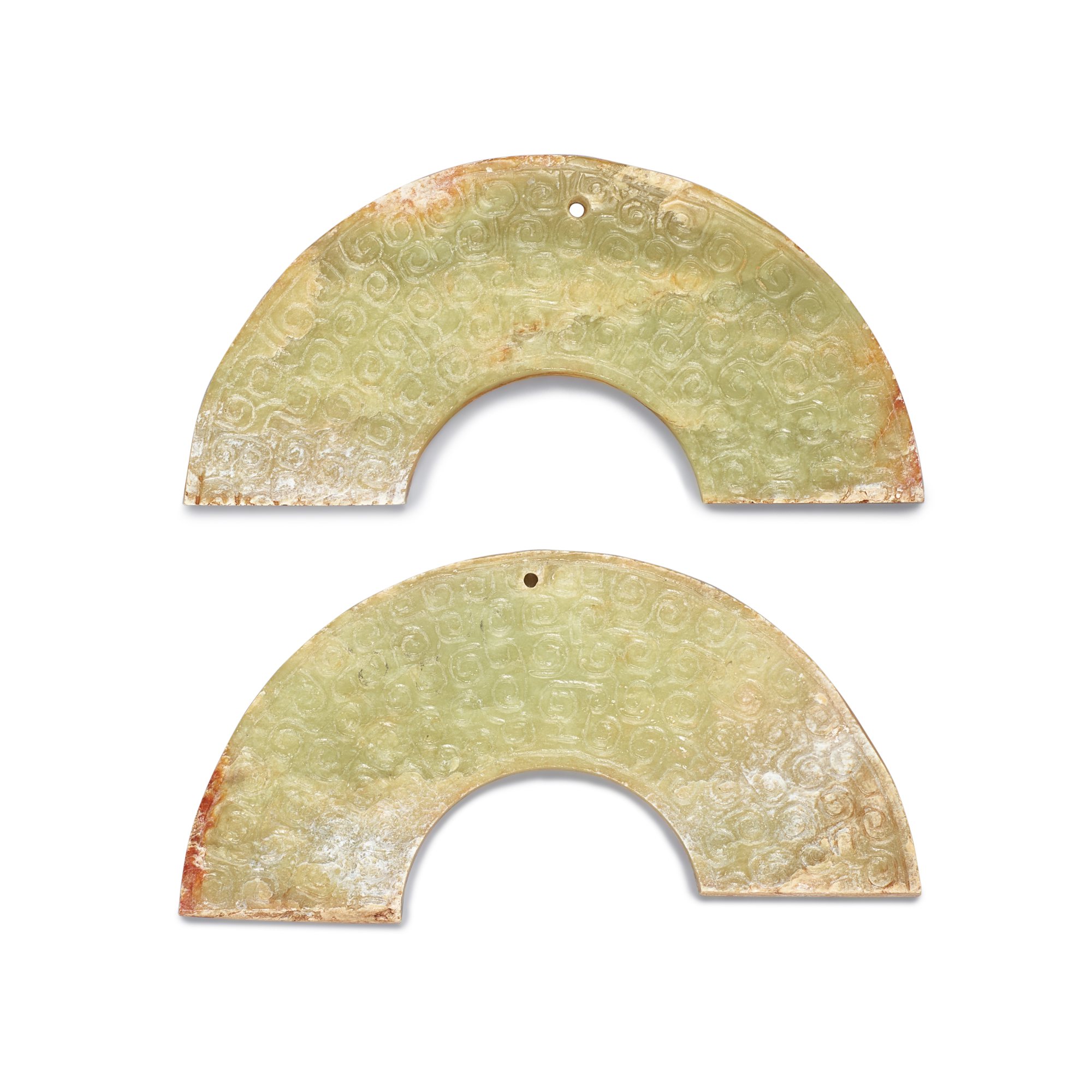 A pair of celadon jade huang, — A pair of celadon jade huang, Probably Warring States period 或戰國 勾連雲紋玉璜一對