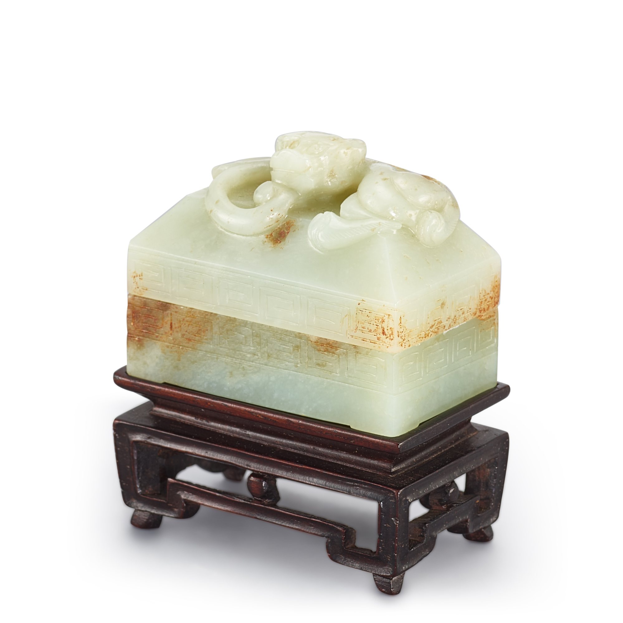 A celadon jade 'chilong' seal paste box and cover, — A celadon jade 'chilong' seal paste box and cover, 17th century 十七世紀 青白玉螭龍紋印盒