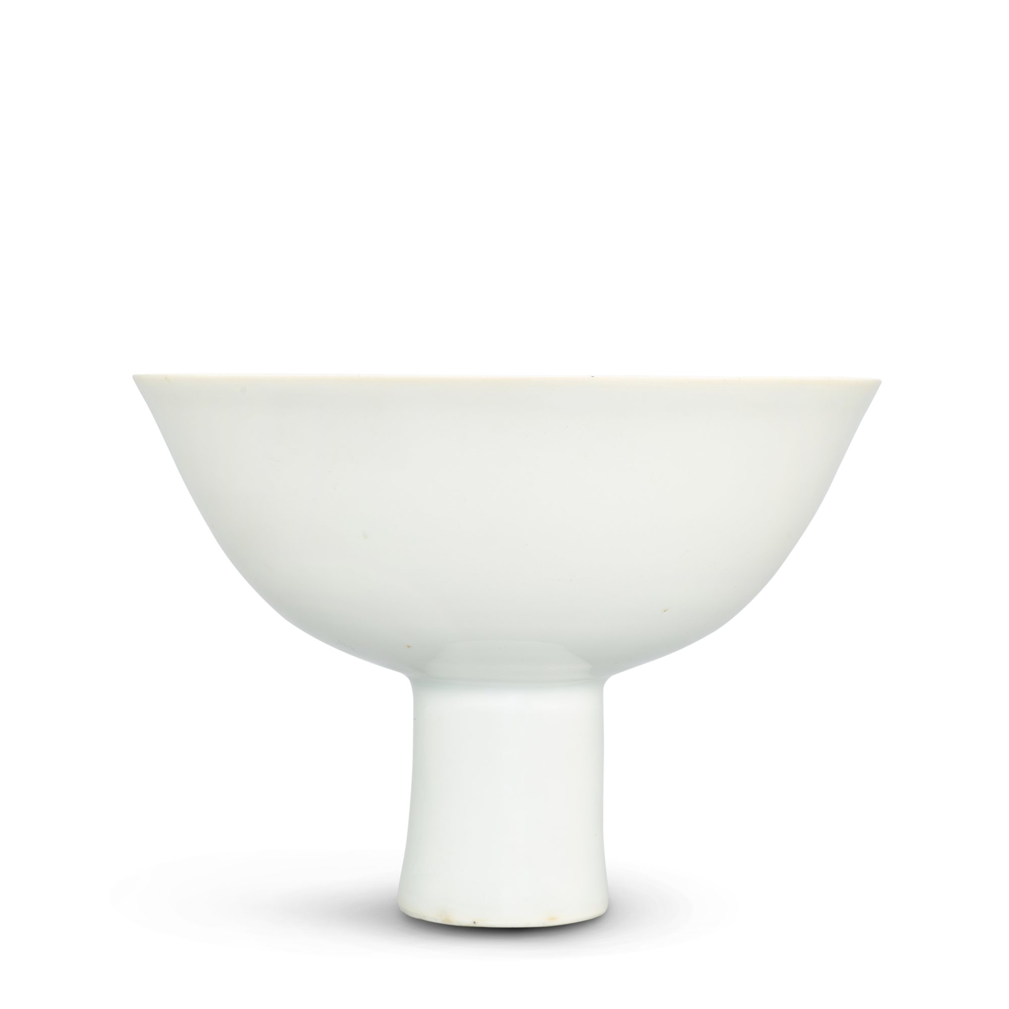 A slip-decorated white-glazed 'prunus' stembowl, — A slip-decorated white-glazed 'prunus' stembowl, Ming dynasty, Chenghua period 明成化 白釉堆折枝梅紋高足盌