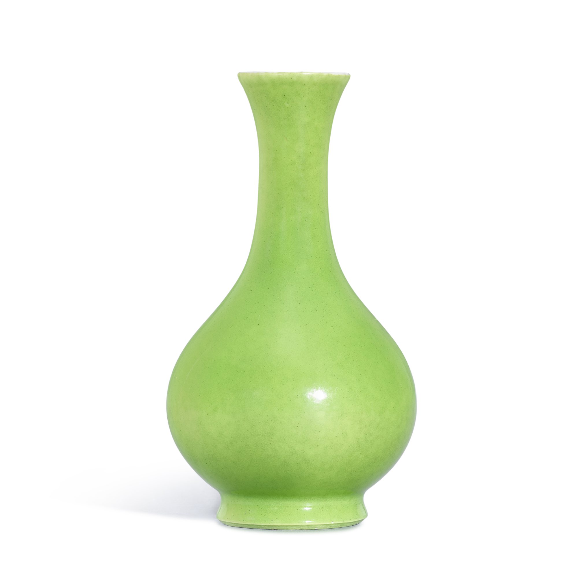 A lime-green glazed vase, — A lime-green glazed vase, Qing dynasty, 18th - 19th century 清十八至十九世紀 秋葵綠釉長頸撇口瓶