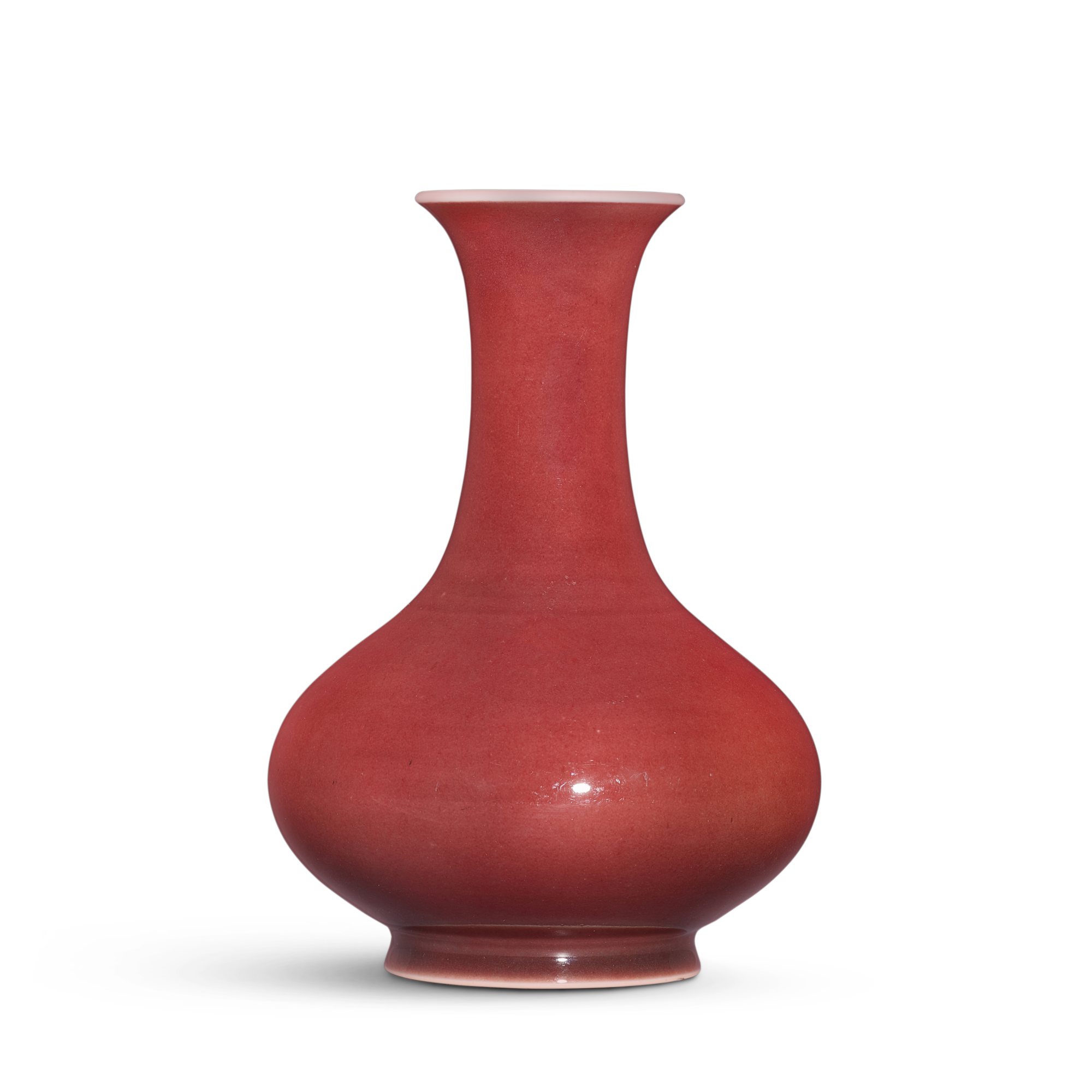 A copper-red glazed bottle vase, — A copper-red glazed bottle vase, Seal mark and period of Qianlong 清乾隆 紅釉荸薺瓶 《大清乾隆年製》款