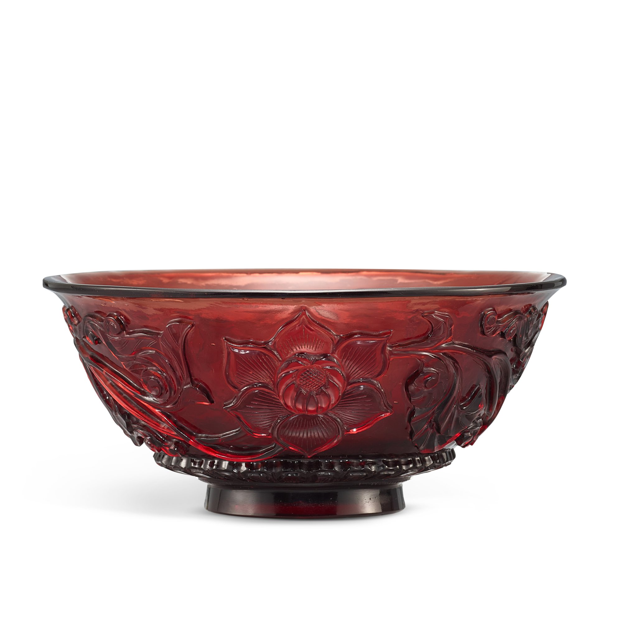A carved ruby-red glass 'lotus' bowl, — A carved ruby-red glass 'lotus' bowl,  Qing dynasty, Qianlong period  清乾隆 寶石紅料雕纏枝蓮紋盌