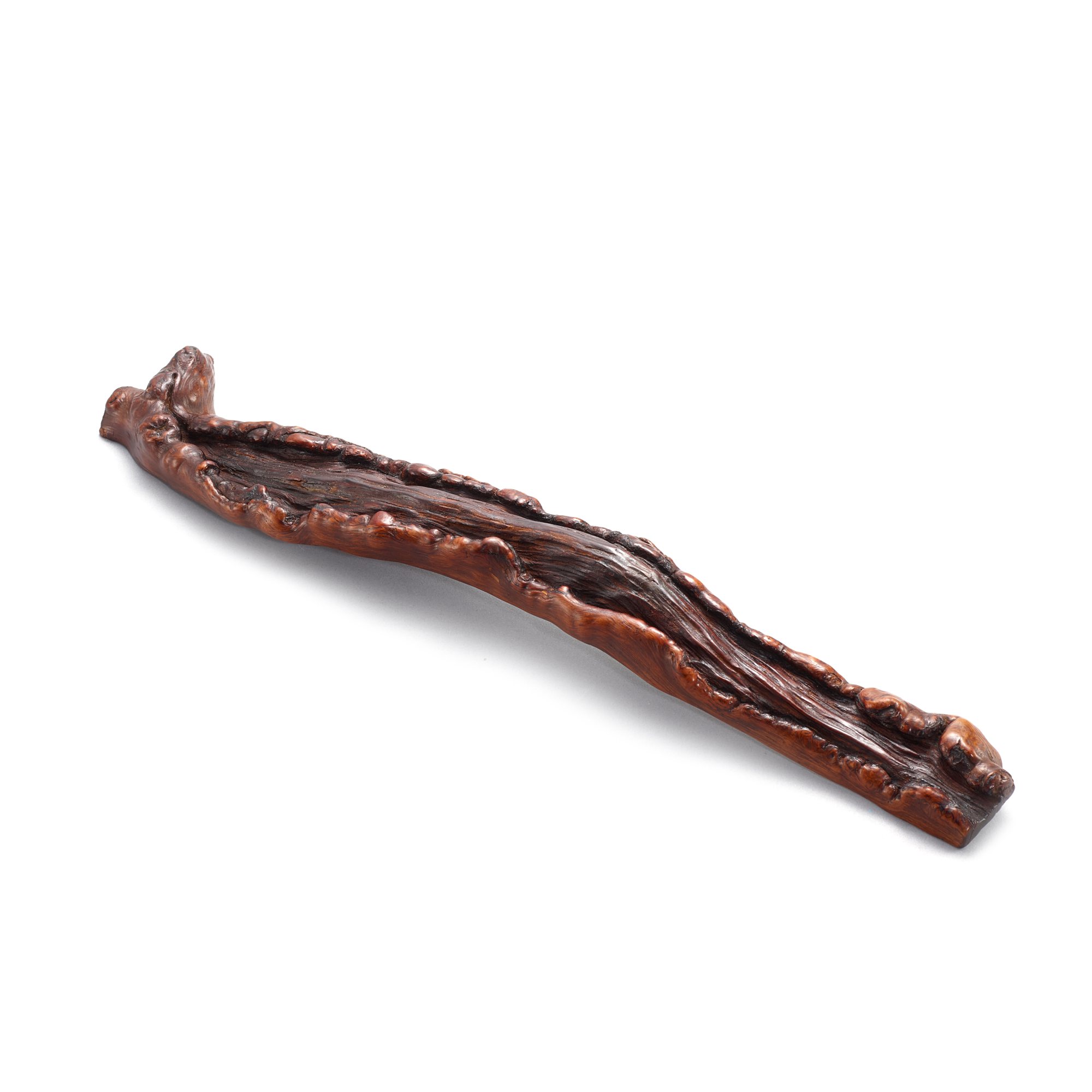 An inscribed rootwood wristrest, — An inscribed rootwood wristrest, Qing dynasty 清 木根隨形題字臂擱