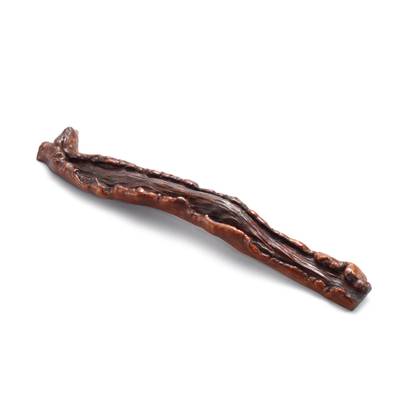 An inscribed rootwood wristrest,