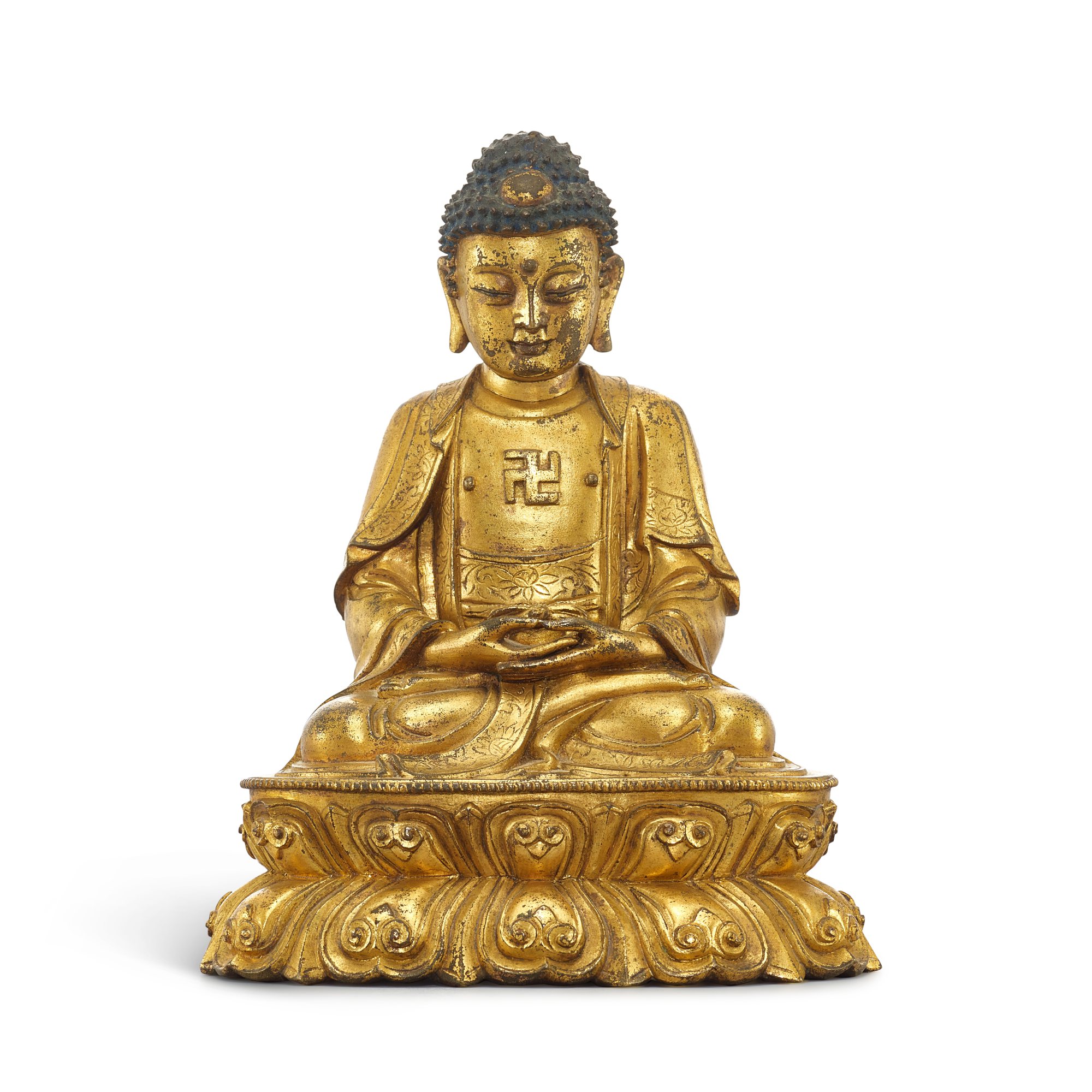 Unknown — A gilt-bronze seated figure of Shakyamuni Buddha, Ming dynasty 明 鎏金銅釋迦牟尼佛坐像