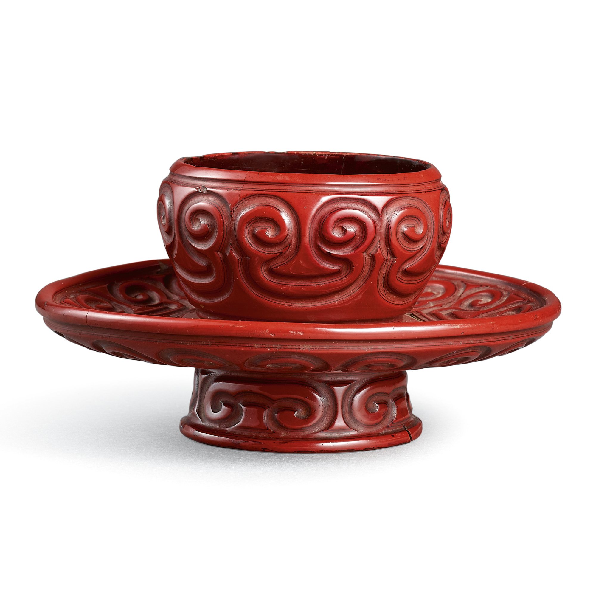 A cinnabar 'tixi' lacquer cup stand, — A cinnabar 'tixi' lacquer cup stand, Yuan dynasty 元 朱面剔犀盞托