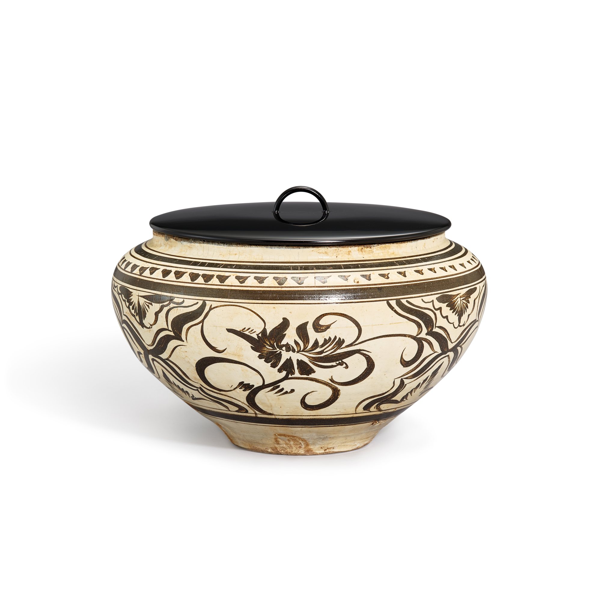 A Cizhou black-painted 'peony' jar, — A Cizhou black-painted 'peony' jar, Yuan dynasty 元 磁州白地黑彩牡丹紋罐