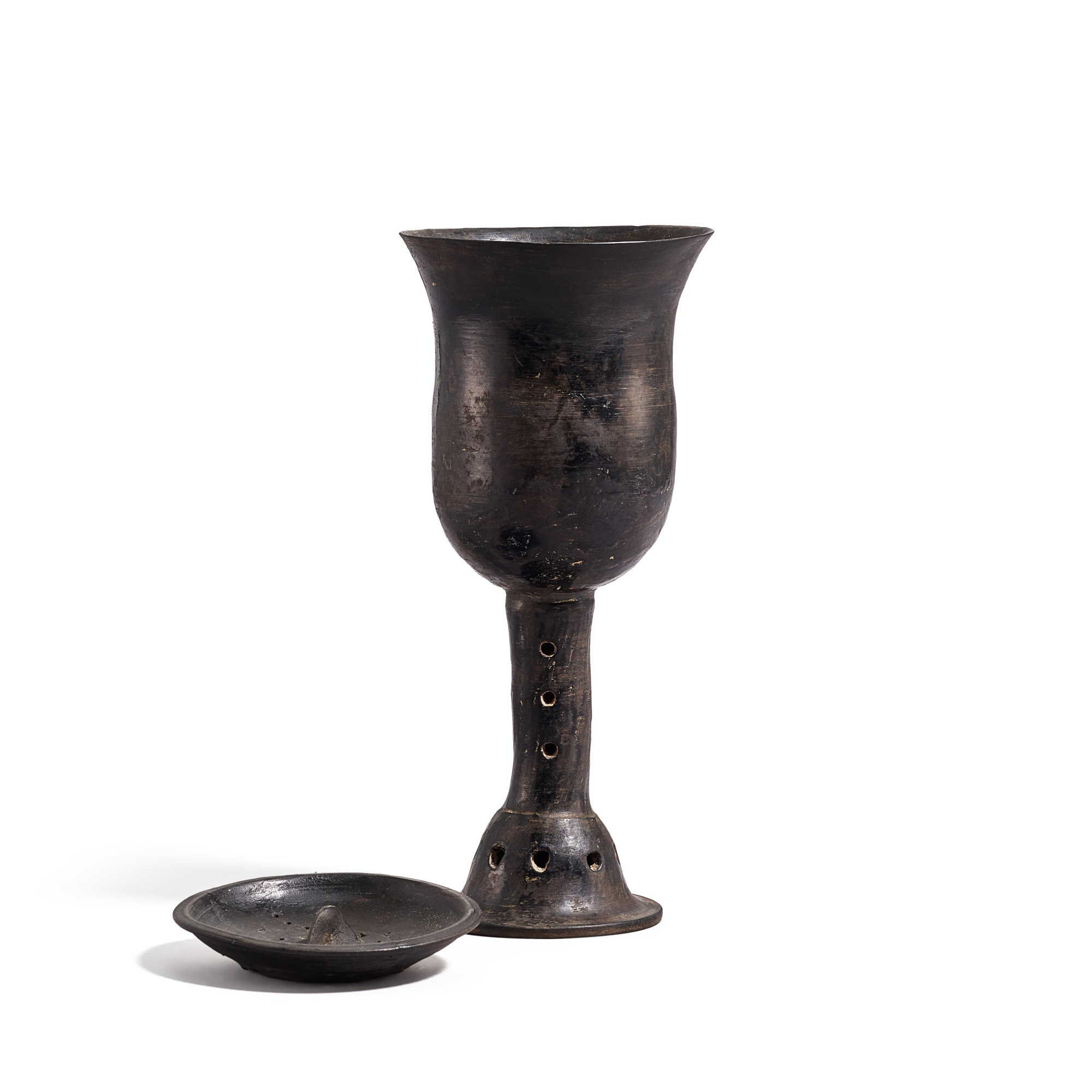 A black eggshell pottery stemcup and cover, — A black eggshell pottery stemcup and cover, Late Dawenkou to early Longshan culture, mid-3rd millennium B.C. 大汶口文化末至龍山文化初 蛋殼黑陶高柄蓋盃