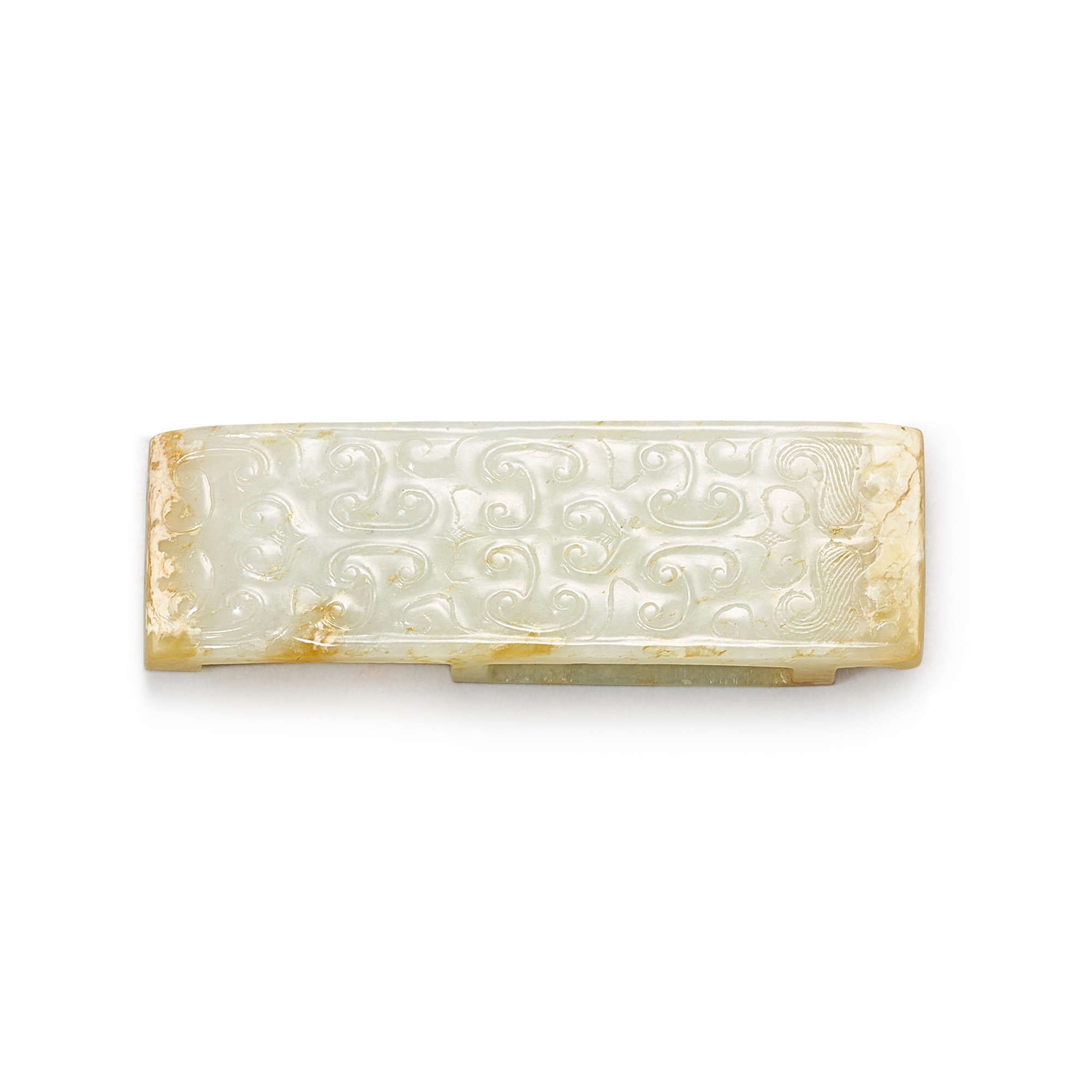 A white jade scabbard slide, — A white jade scabbard slide, Eastern Zhou dynasty, Warring States period - Han dynasty 東周戰國時期至漢 白玉獸面紋劍璏