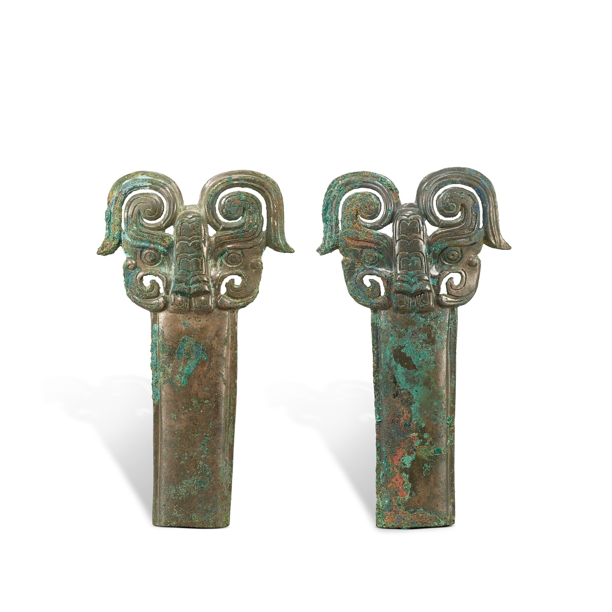 Unknown (Historical) — A pair of bronze 'mythical beast' horses' harness frontlets, Western Zhou dynasty 西周 青銅獸面馬冠飾一對