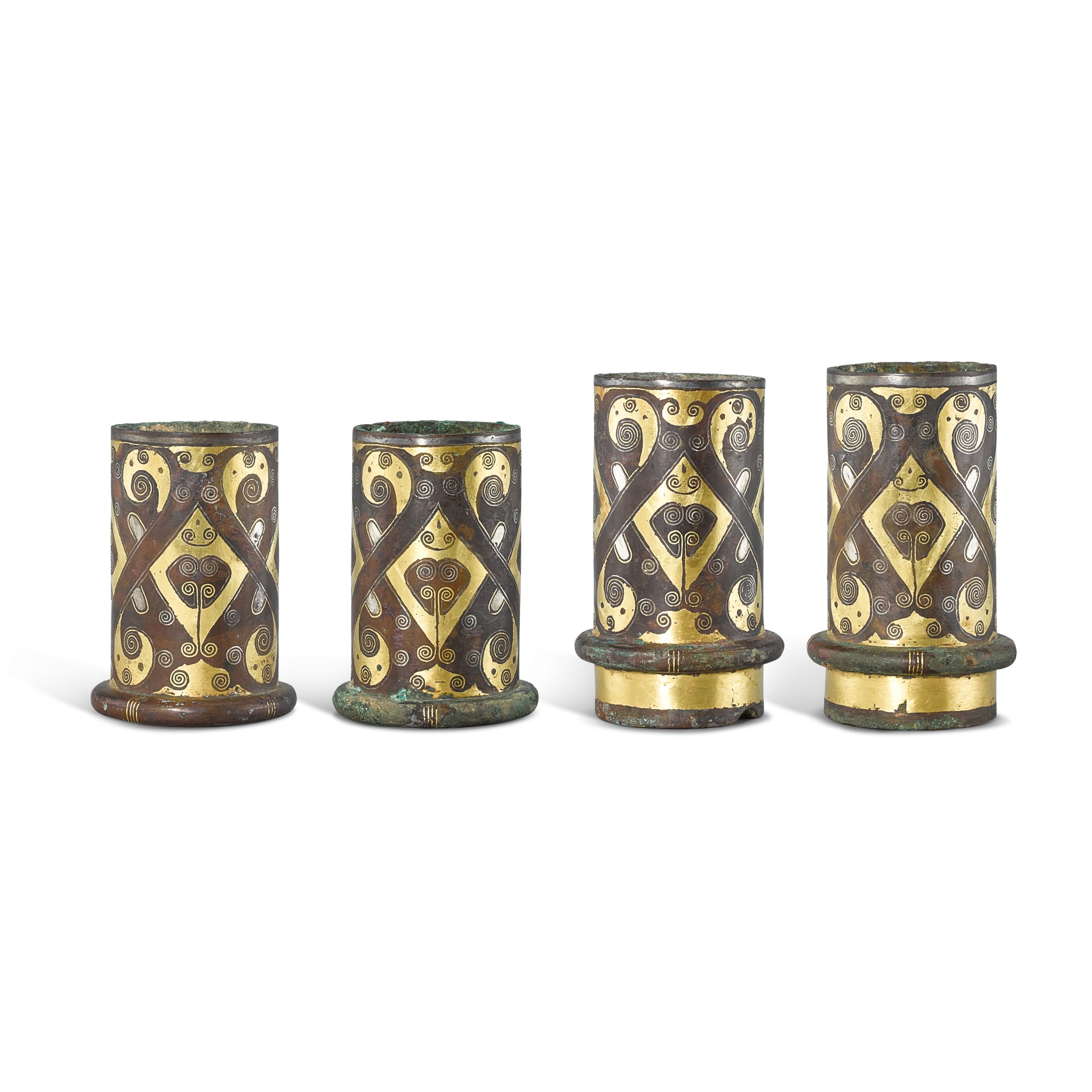 Four gold and silver-inlaid bronze chariot fittings, — Four gold and silver-inlaid bronze chariot fittings, Eastern Zhou dynasty, Warring States period - Han dynasty 東周戰國時期至漢　銅錯金銀車馬飾四件