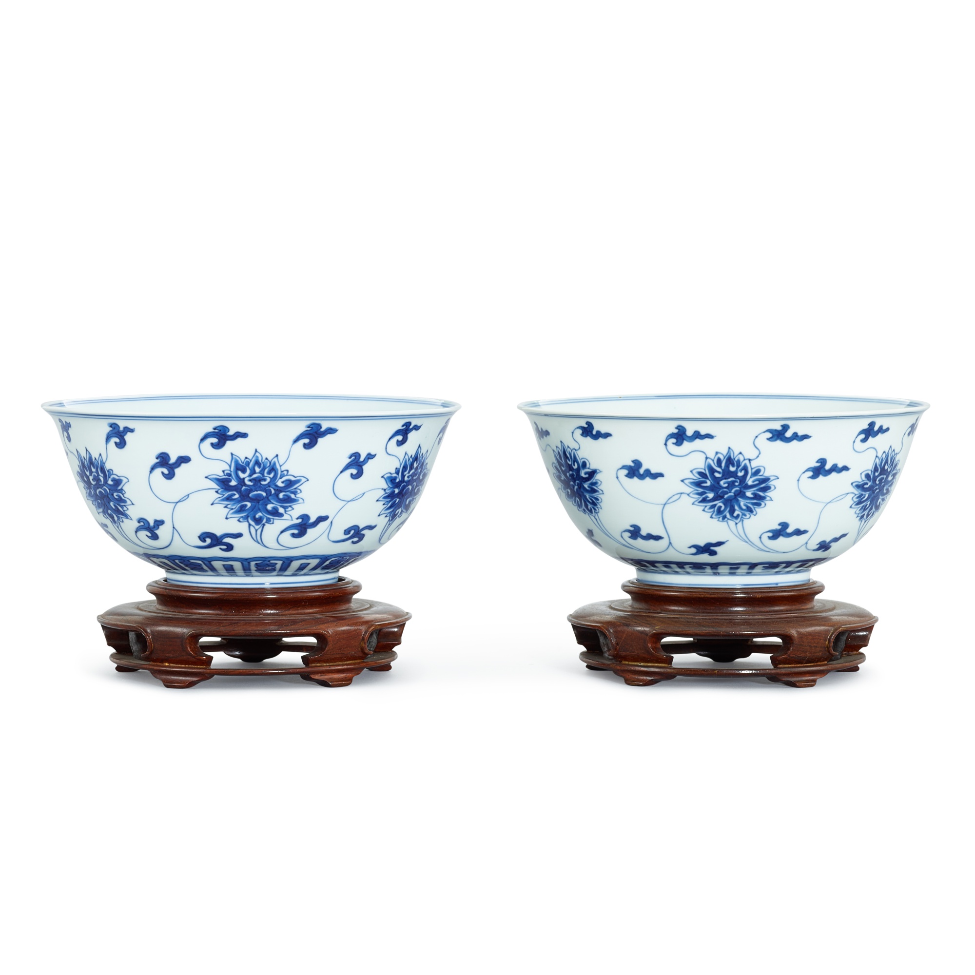 A pair of blue and white 'lotus' bowls, — A pair of blue and white 'lotus' bowls, Seal marks and period of Kangxi 清康熙 青花纏枝蓮紋盌一對 《大清康熙年製》款