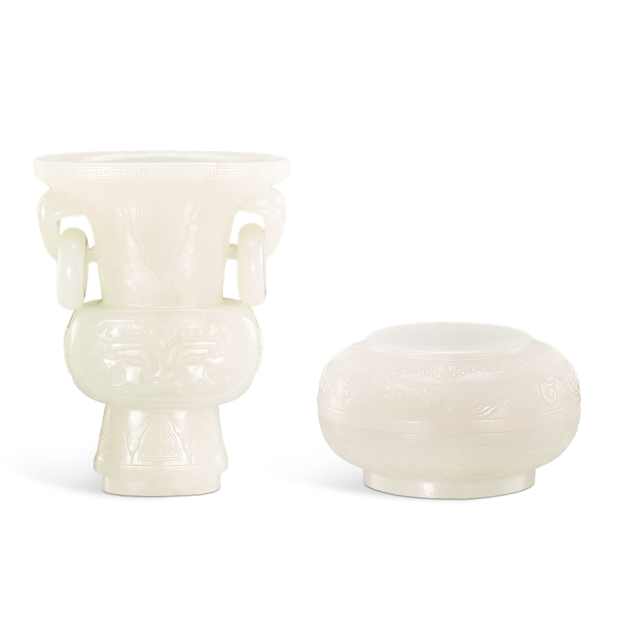 Unknown (Historical) — A white jade archaistic gu vase and a circular box and cover, Late Qing dynasty 晚清 白玉雕仿古活環耳花觚及圓蓋盒一組兩件