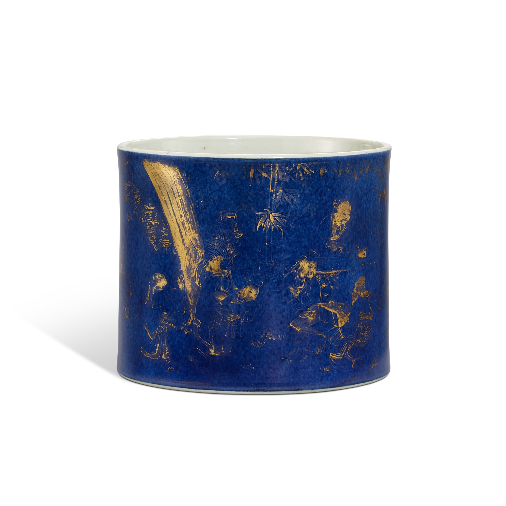 A powder-blue ground gilt-decorated 'Four Accomplishments' brushpot, — A powder-blue ground gilt-decorated 'Four Accomplishments' brushpot, Qing dynasty, Kangxi period 清康熙 灑藍釉描金四藝圖筆筒