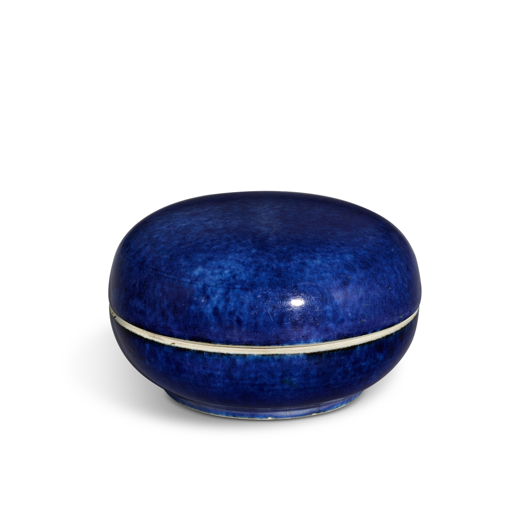 A powder-blue glazed seal-paste box and cover, — A powder-blue glazed seal-paste box and cover, Qing dynasty, 18th century 清十八世紀 灑藍釉圓蓋盒