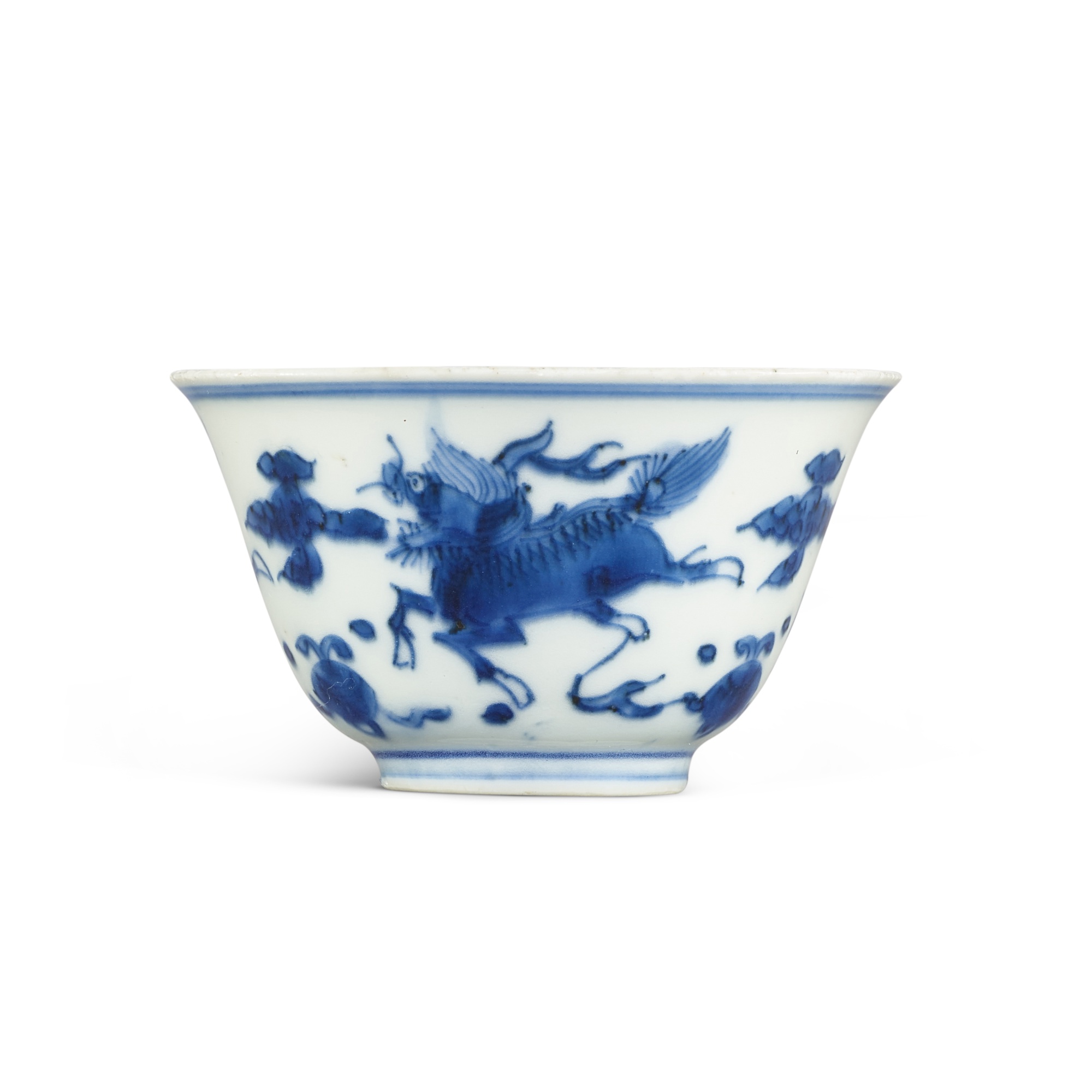 A blue and white 'mythical beast' cup, — A blue and white 'mythical beast' cup, 17th century 十七世紀 青花瑞獸紋小盃 《大明嘉靖年製》仿款