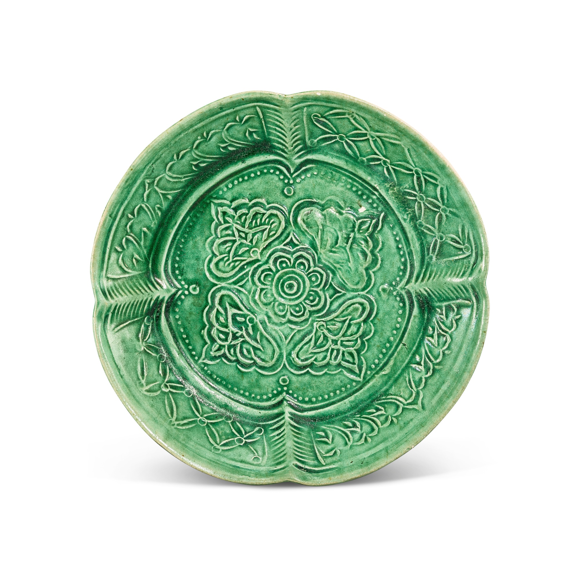 A moulded green-glazed pottery dish, — A moulded green-glazed pottery dish, Liao dynasty 遼 綠釉印花花口盤