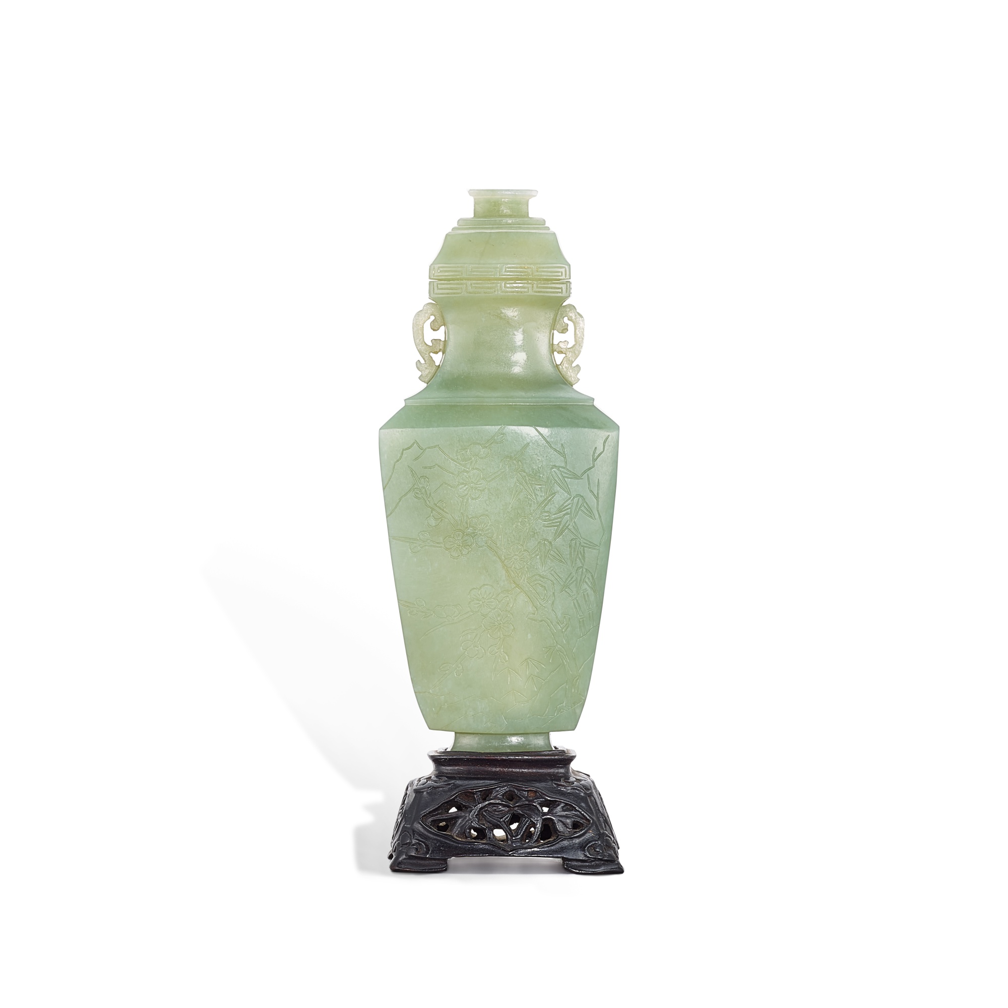 An celadon jade 'Three Friends of Winter' vase and cover, — An celadon jade 'Three Friends of Winter' vase and cover, Qing dynasty, Qianlong – Jiaqing period 清乾隆至嘉慶 青玉雕歲寒三友紋雙耳蓋瓶