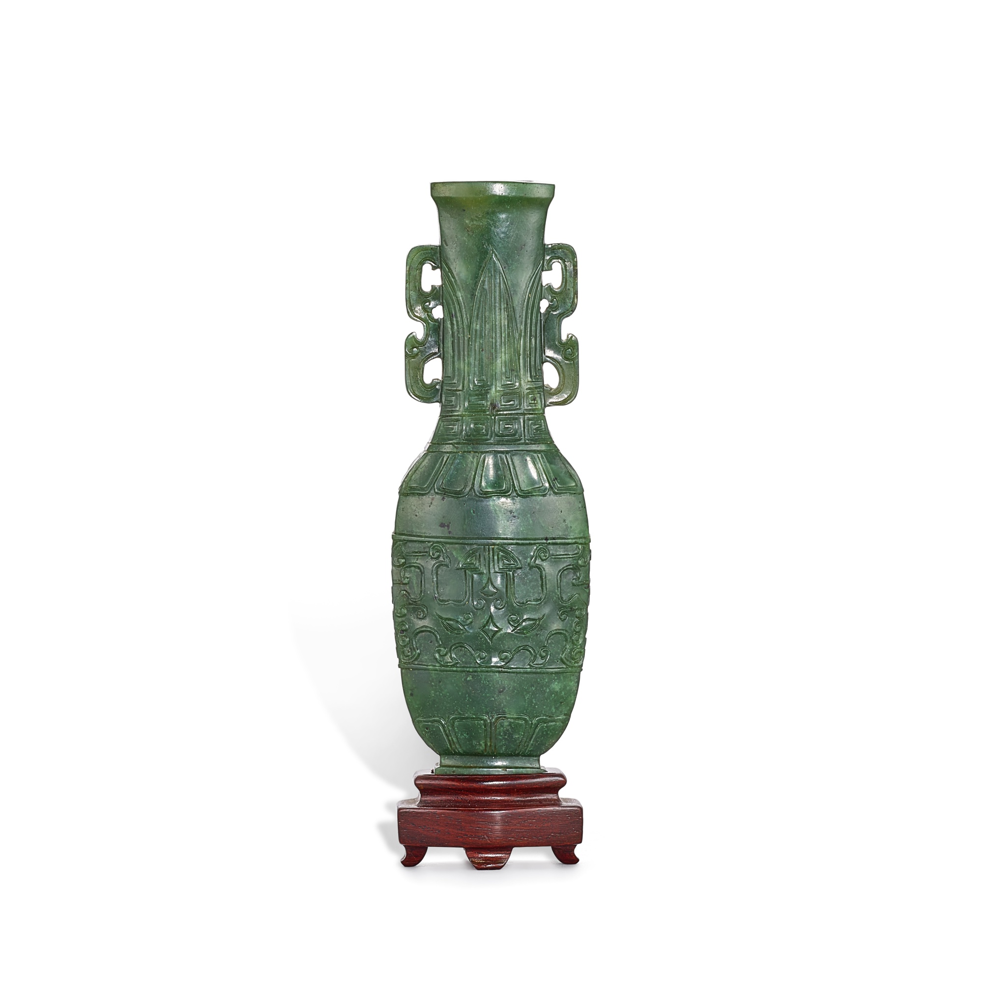 An archaistic spinach-green jade 'taotie' vase, — An archaistic spinach-green jade 'taotie' vase, Qing dynasty, Qianlong – Jiaqing period 清乾隆至嘉慶 碧玉雕仿古饕餮紋瓶
