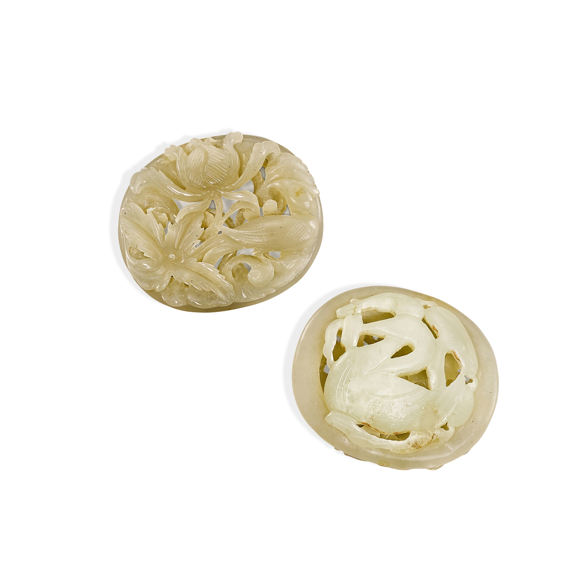 Two reticulated celadon jade ‘bird’ pendants,